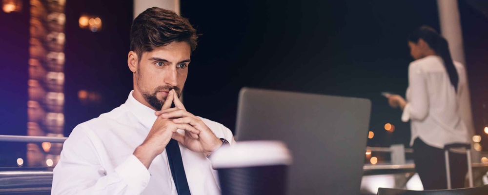 Business person with laptop working at airport lounge