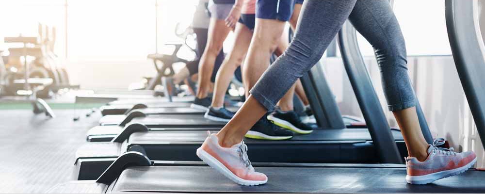 Individuals exercising on different cardio-centric machines