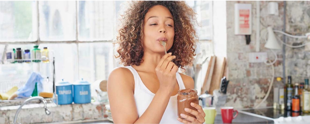  picture of a girl indulging eating chocolate