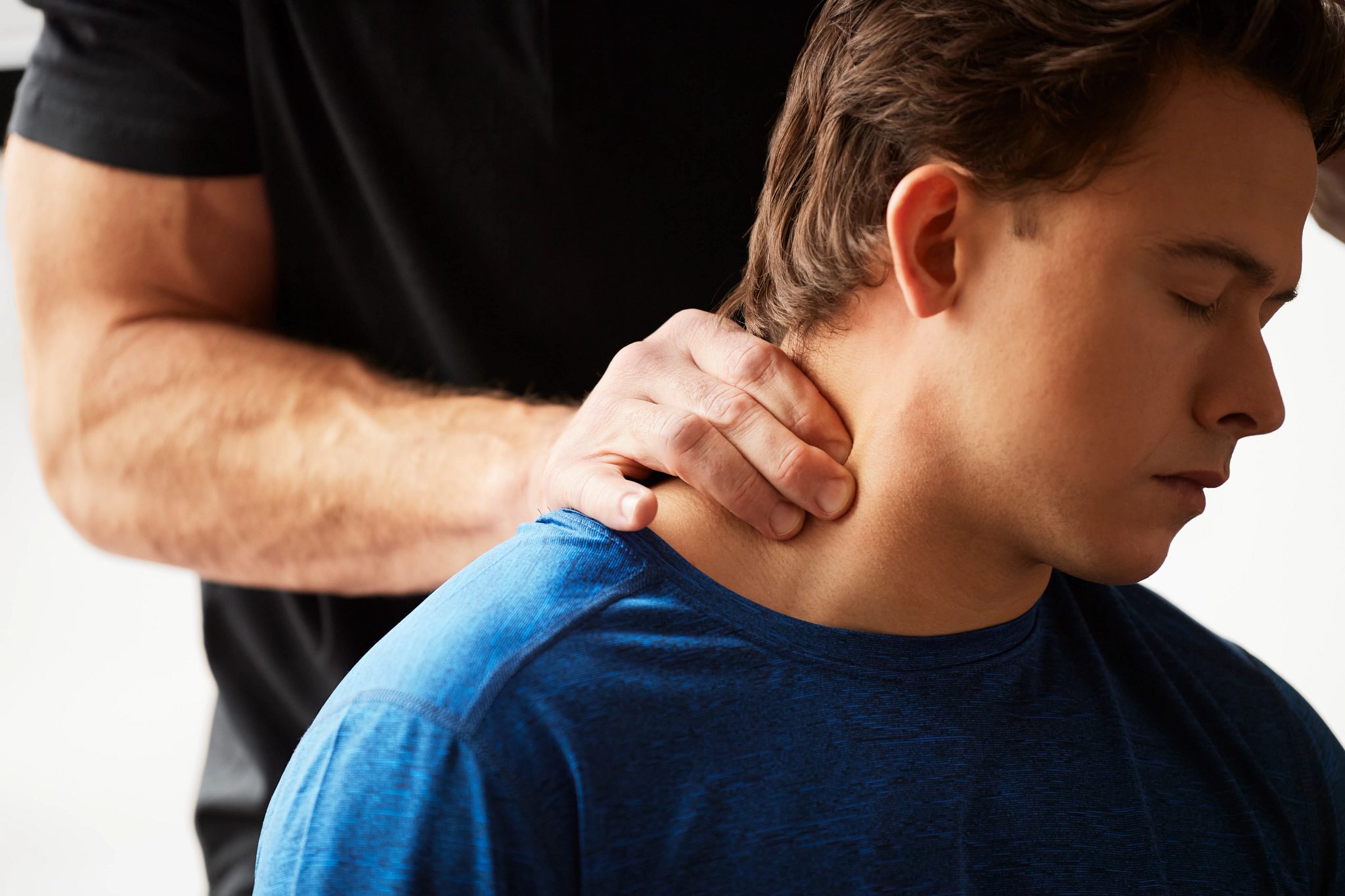 Chiropractor performing an adjustment on a patient's neck
