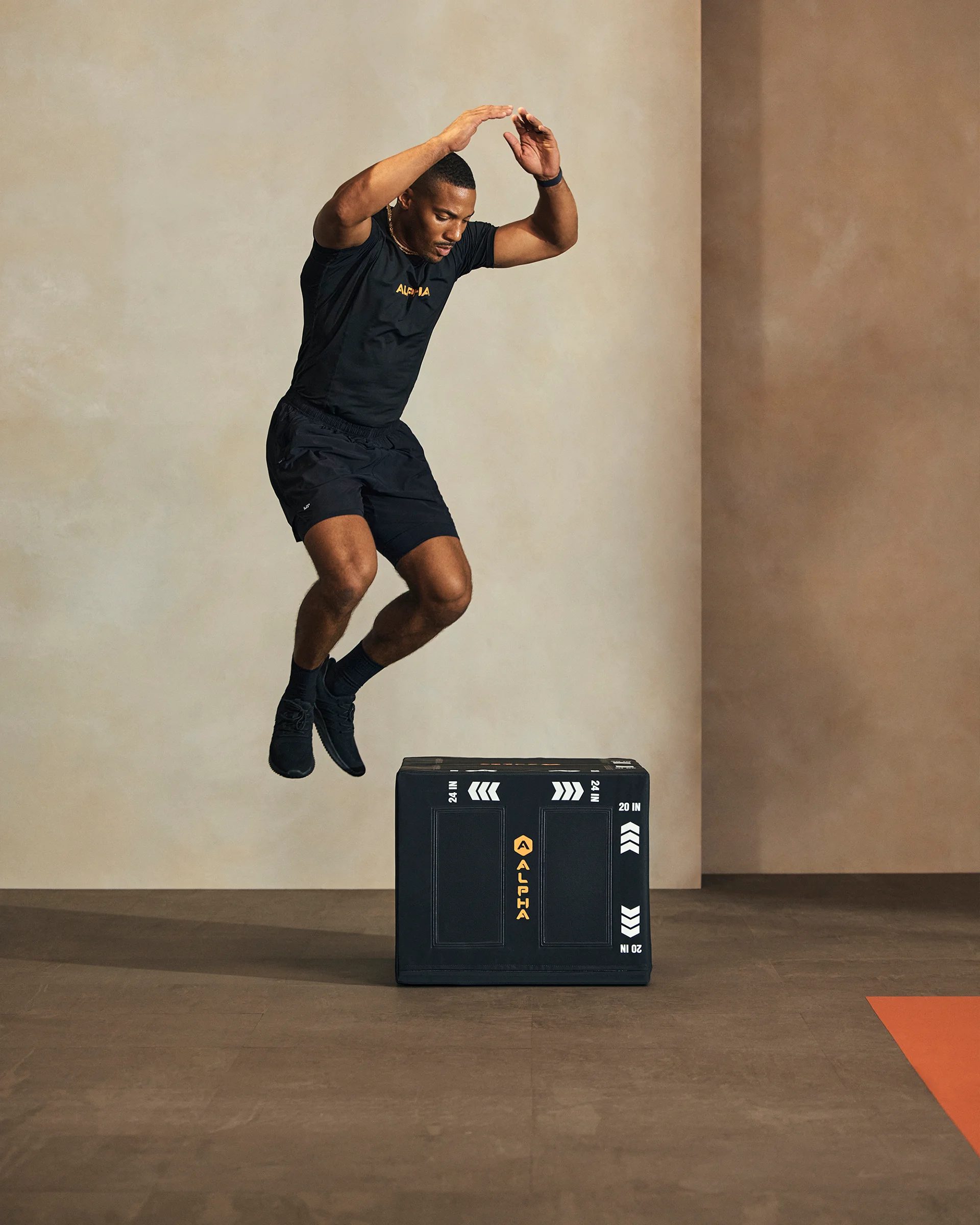 a man jumping over a box