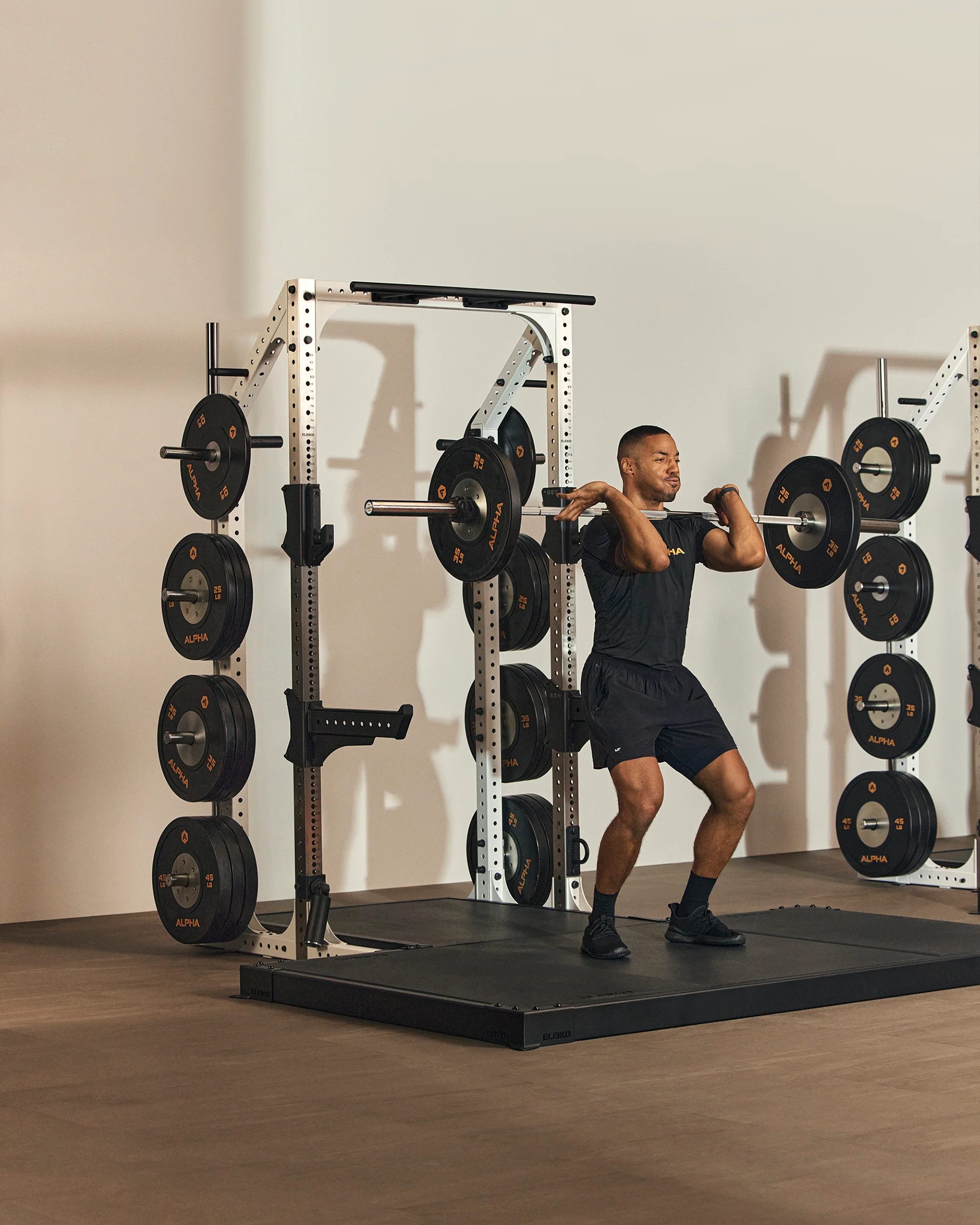 a man performing a clean and jerk