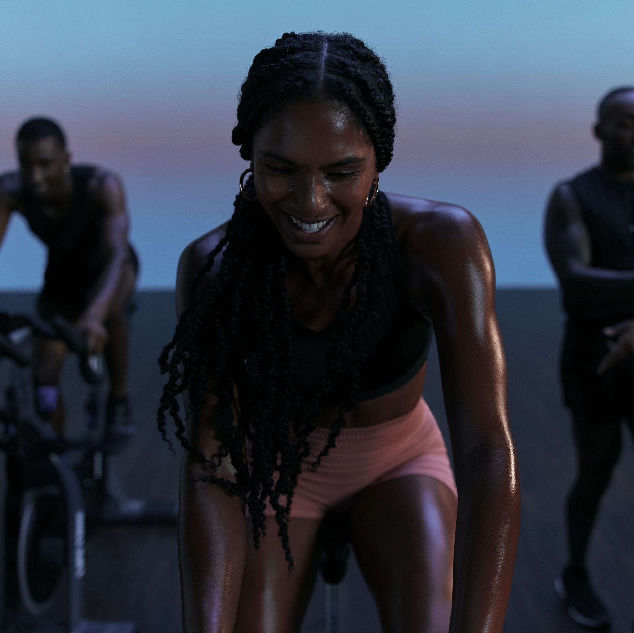 Front view of cyclist in AMP spin class at Life Time