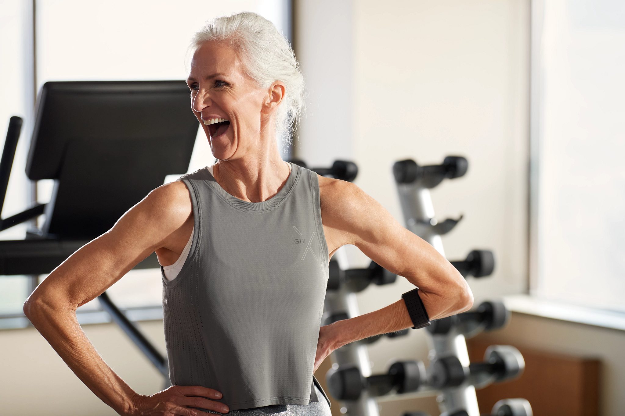 Portrait of a smiling GTX class participant looking off camera to her right