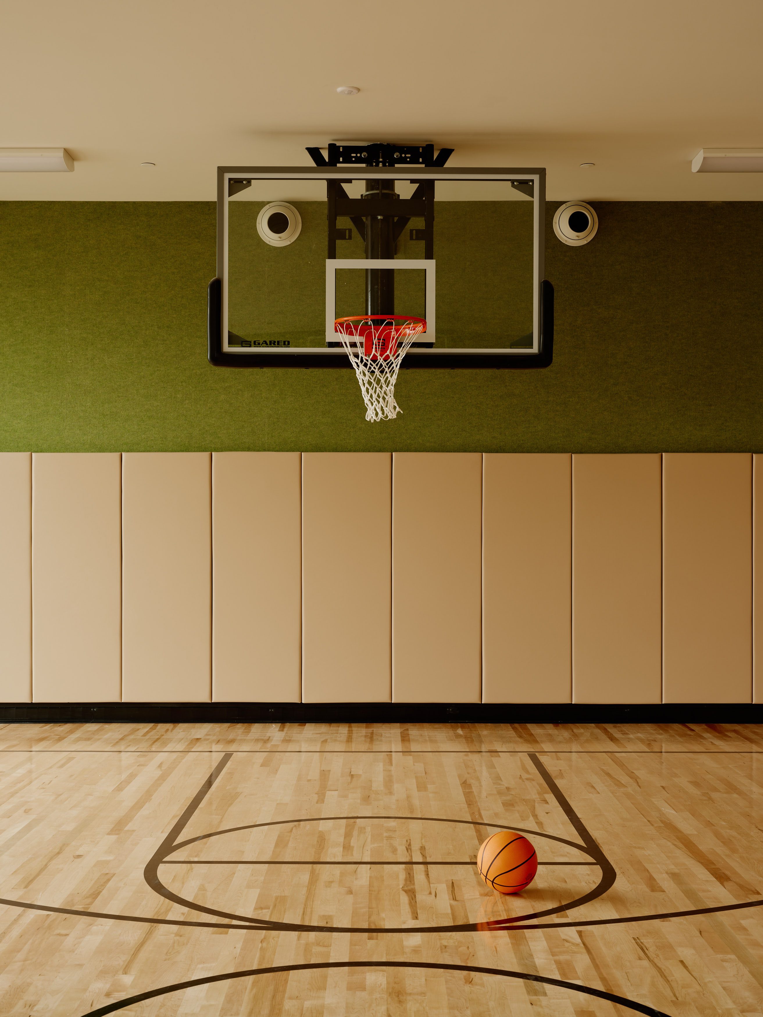 basketball court with a basketball sitting on the ground