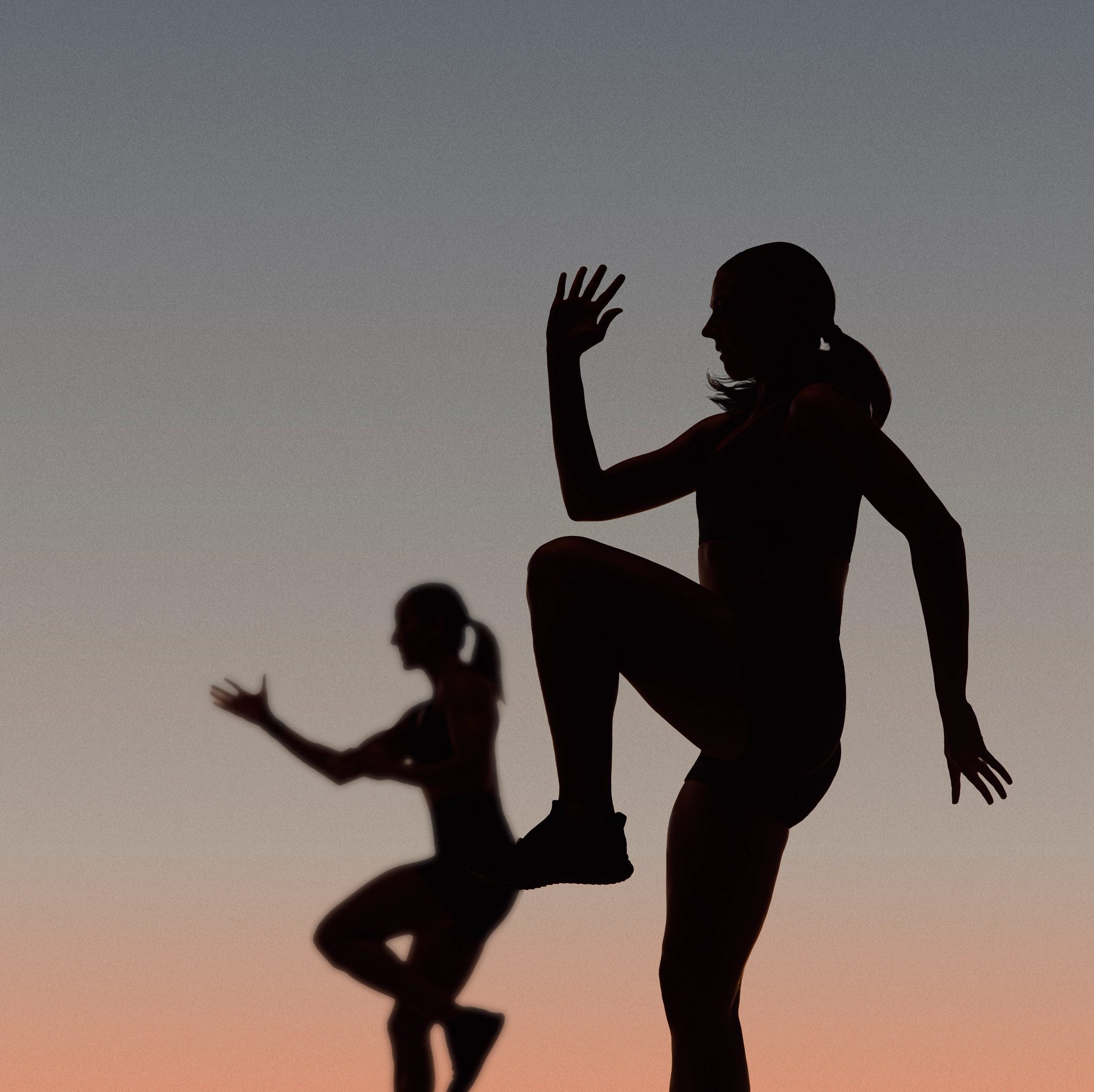 Two Life Time Burn cardio class members in silhouette