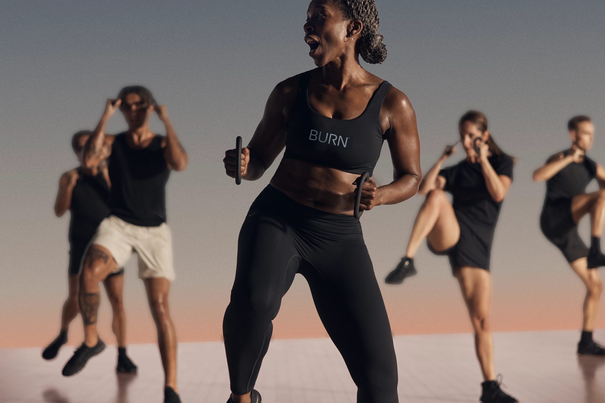 Burn cardio class participants being led by an instructor at Life Time
