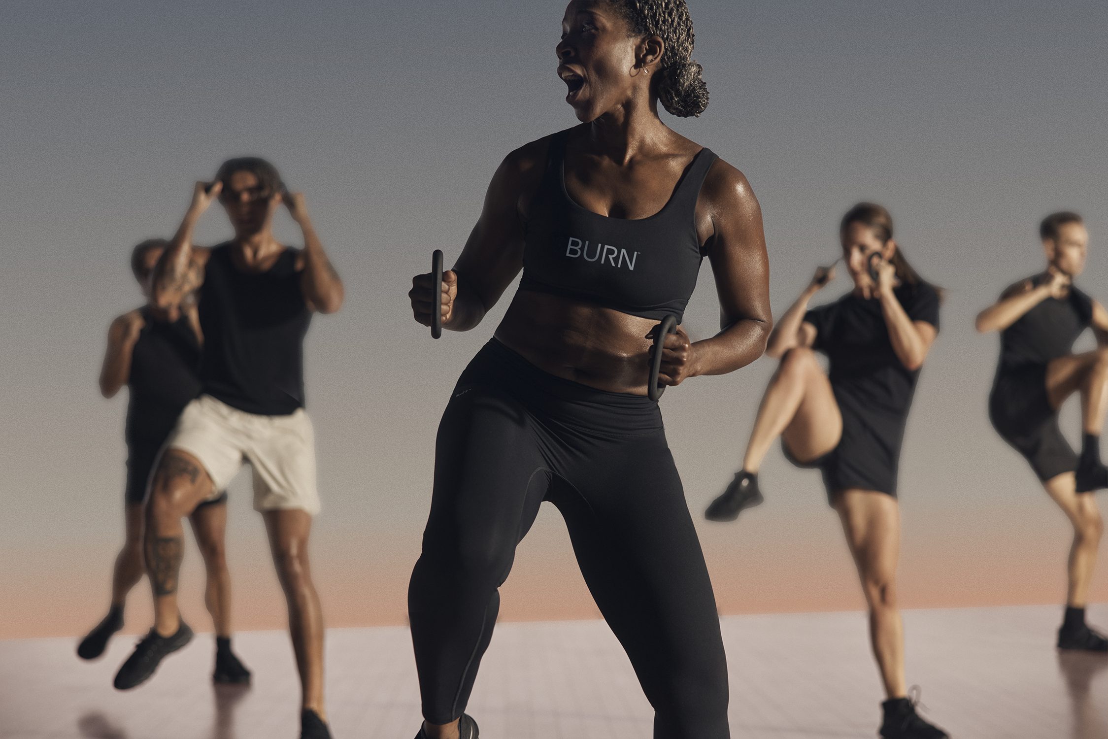 Burn cardio class participants being led by an instructor at Life Time