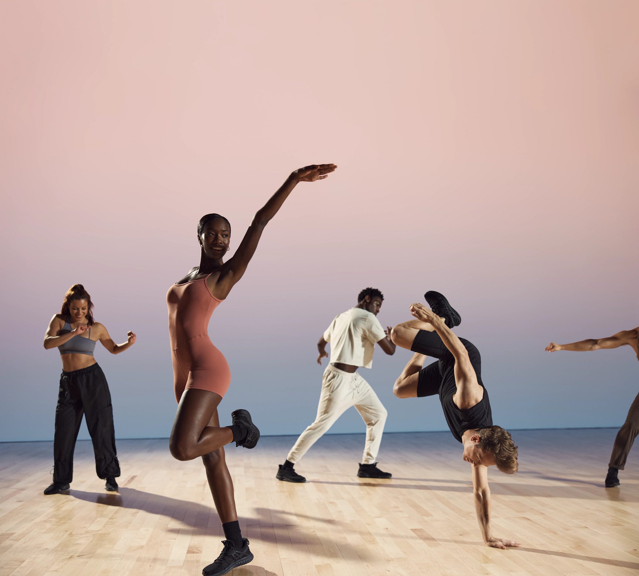 Danze class participants in various positions at Life Time