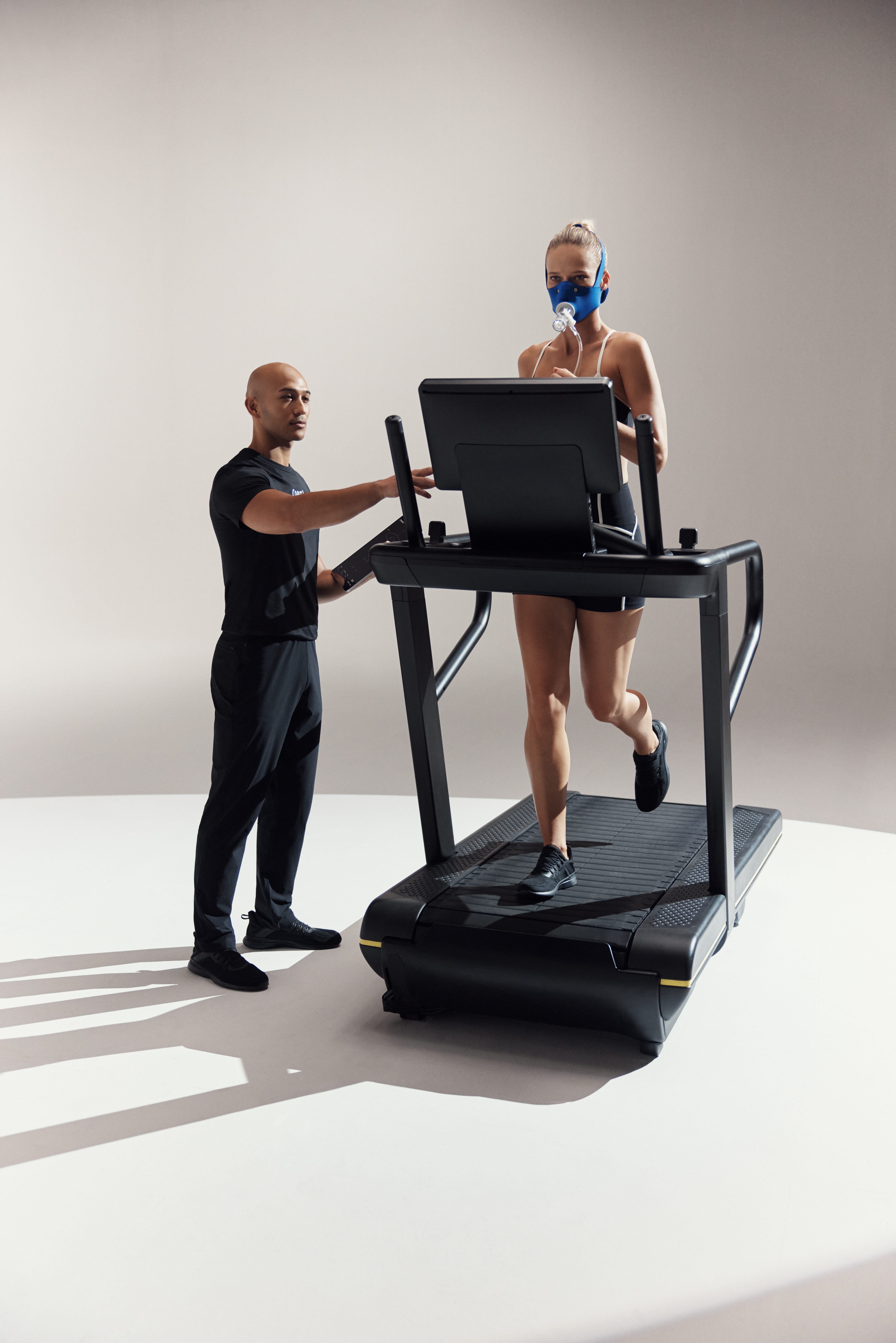 A client running on a treadmill wearing a vo2 mask during a Dynamic Personal Training assessment