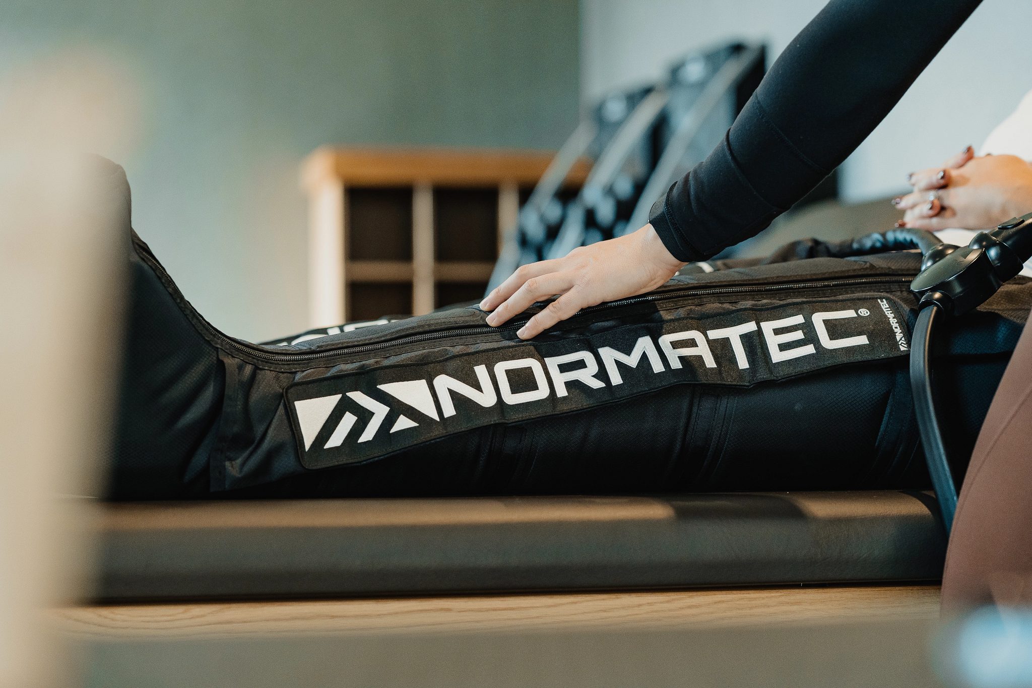 Close up of a Normatec boot on a member's leg during a dynamic stretch session at Life Time