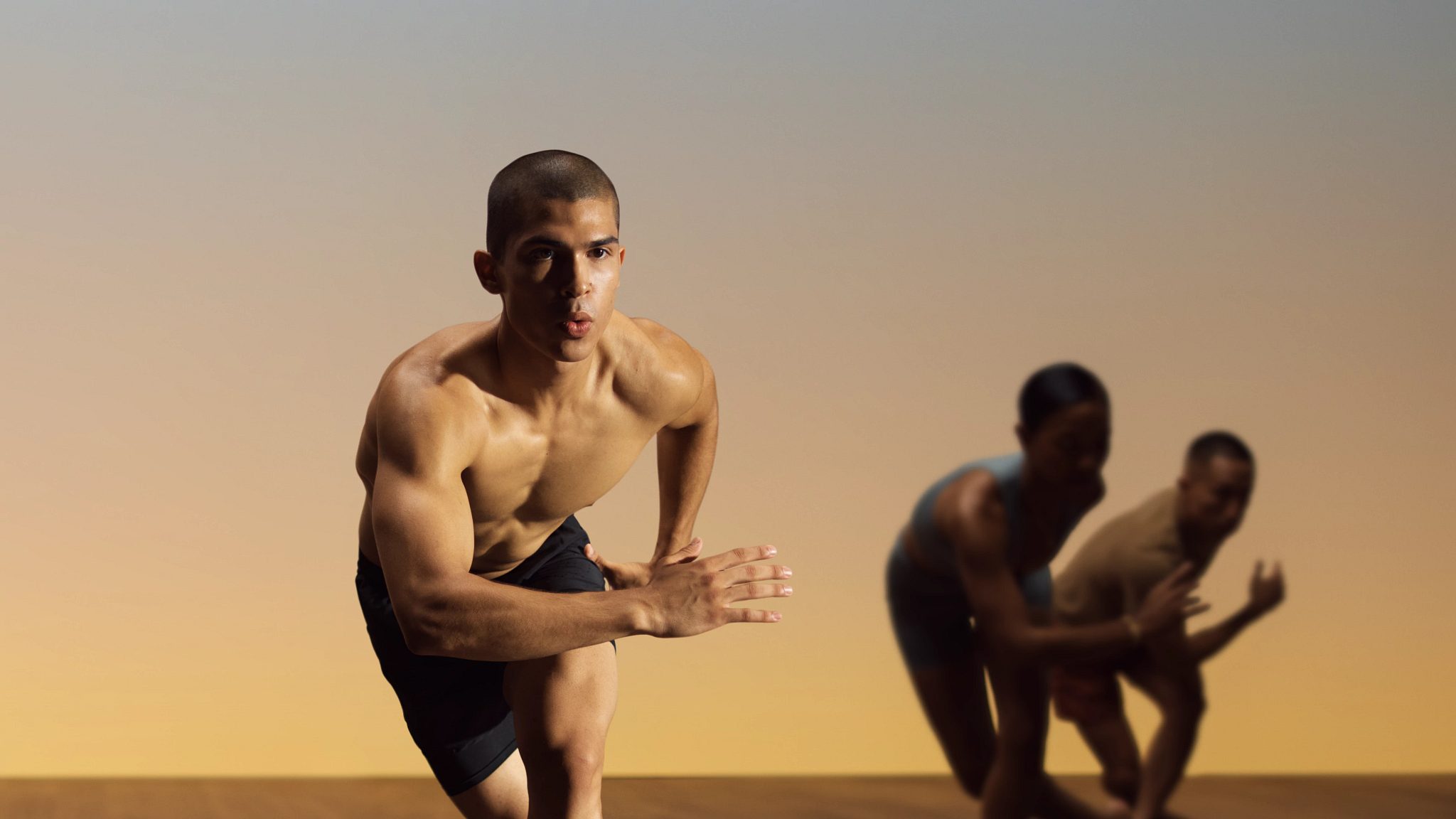 Yogis in motion during a fire yoga class at Life Time