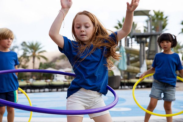 two girls playing with hula hoops