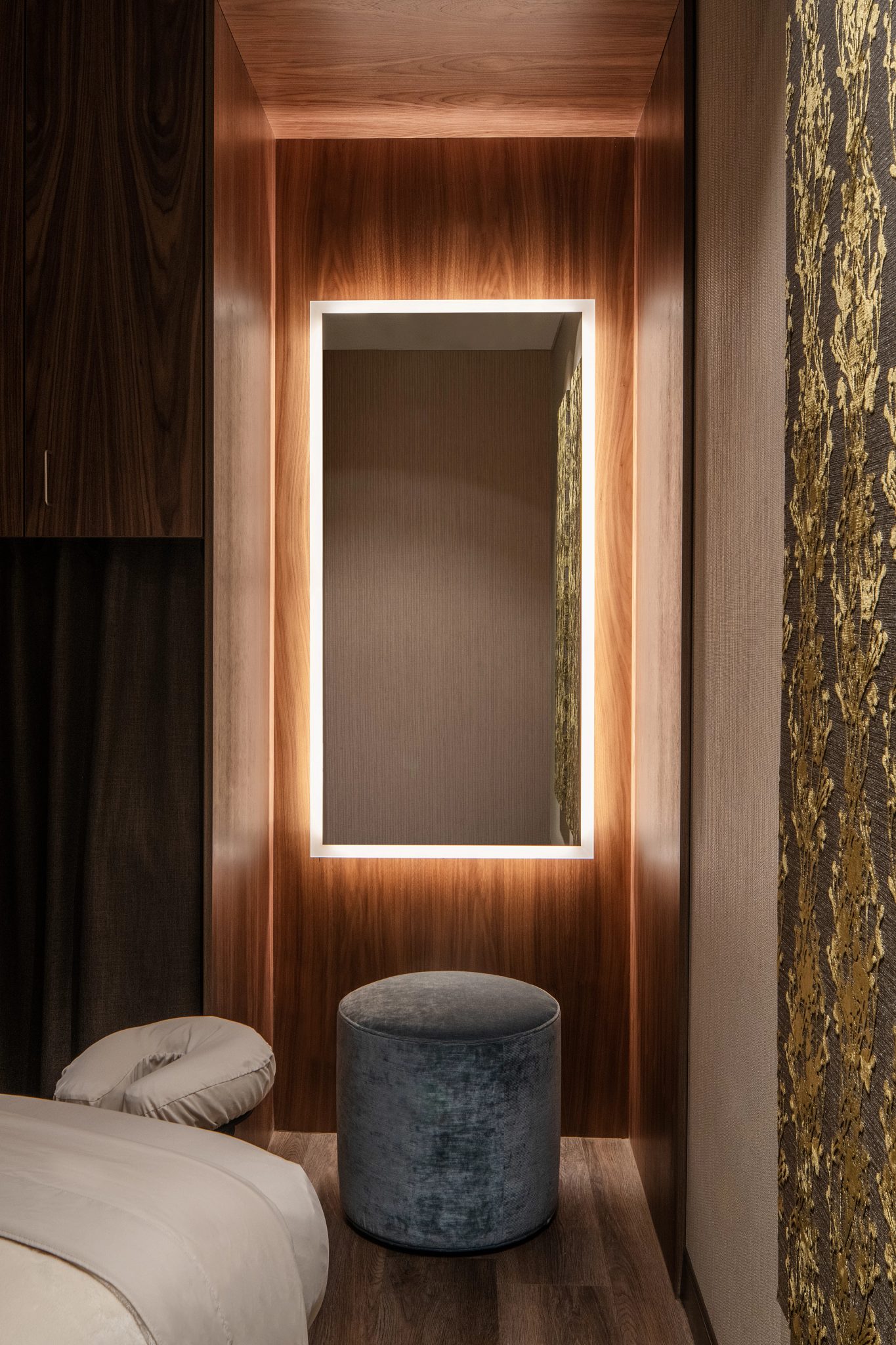 Brightly lit mirror in a massage room at Life Time