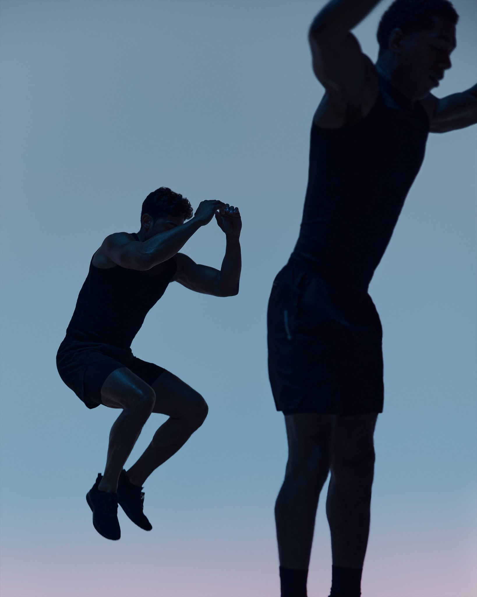 Maxout strength class featuring the silhouette of two people jumping