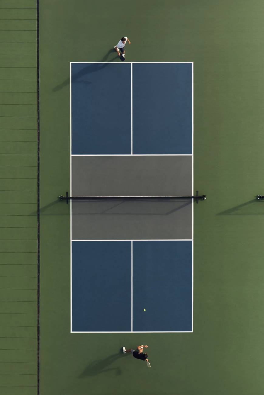 Aerial view of a doubles pickleball match on a Life Time court