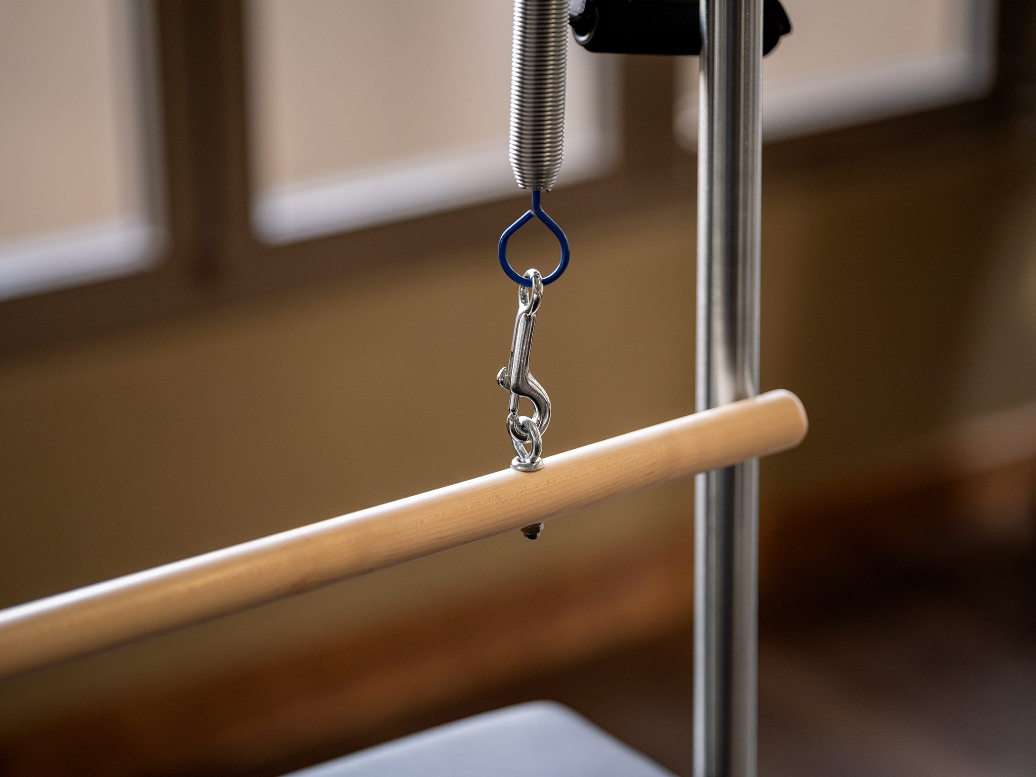Close-up of a Pilates reformer machine.
