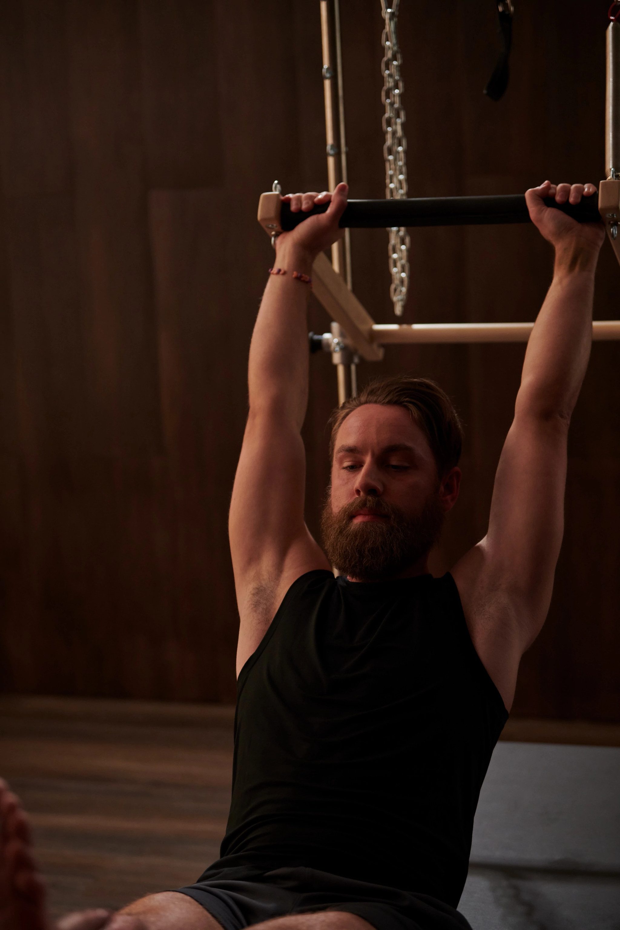 A man stretching in a pilates class