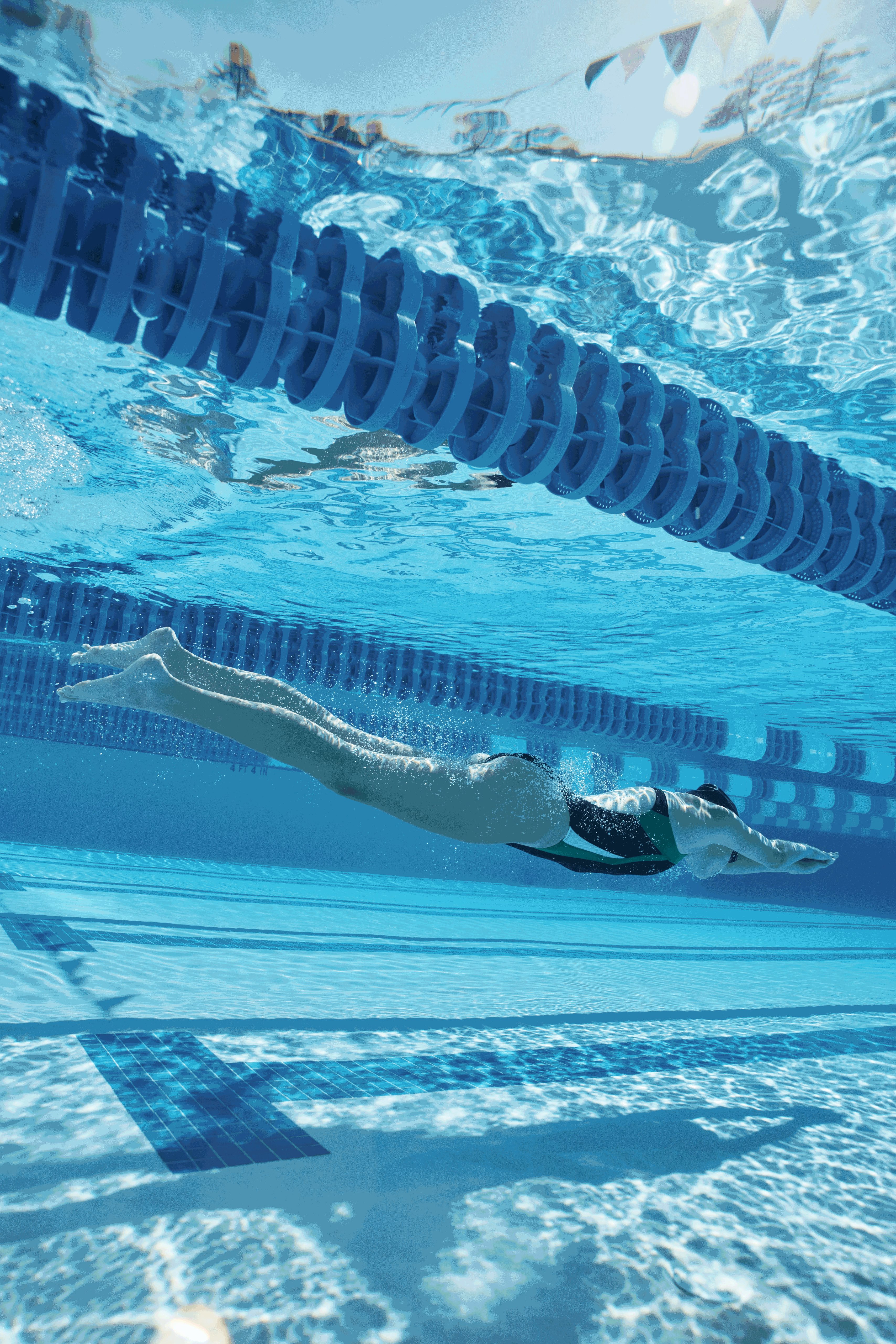 girl swimming in a lap pool