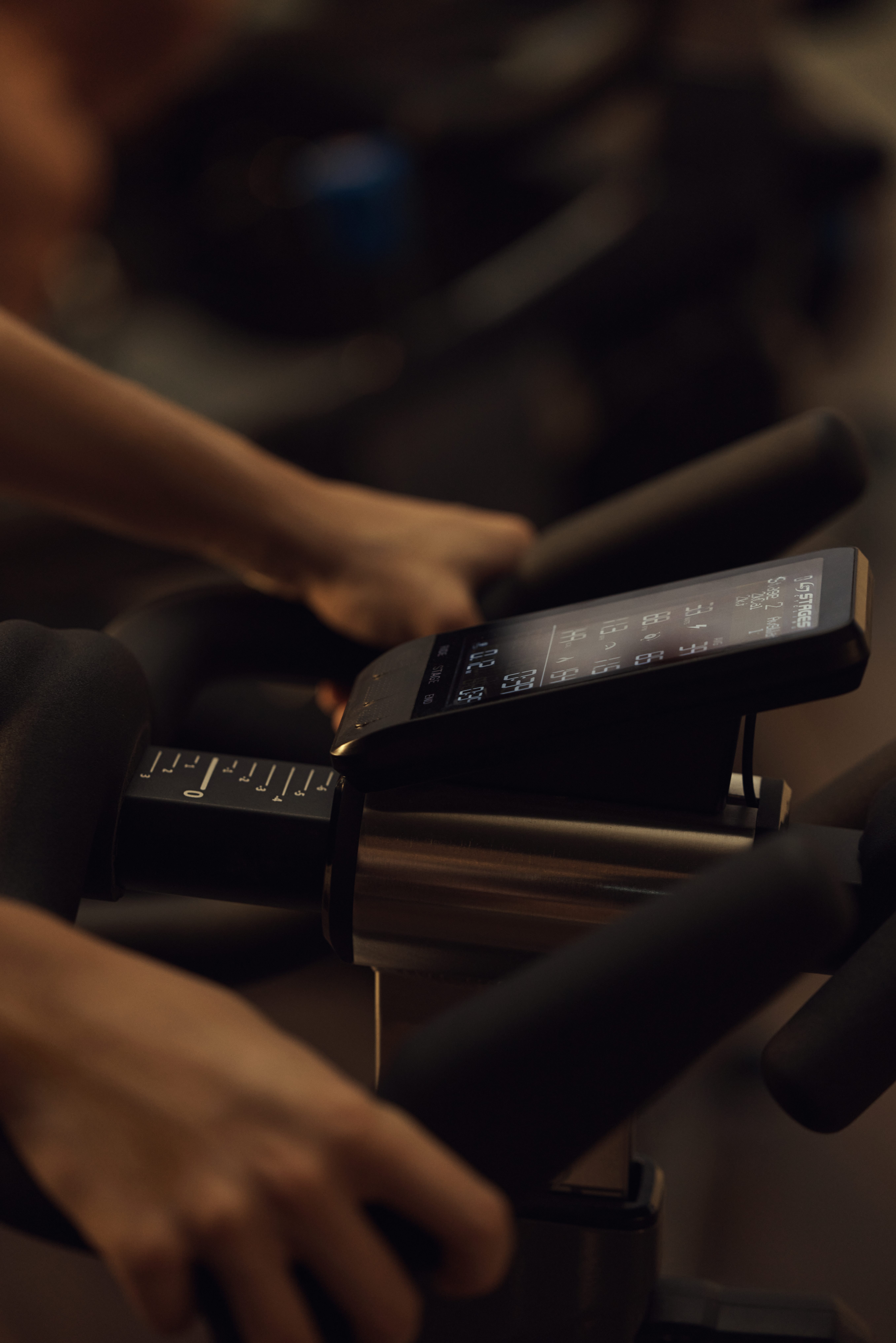 A close up of the output screen on a spin bike in a PWR cycle class at Life Time