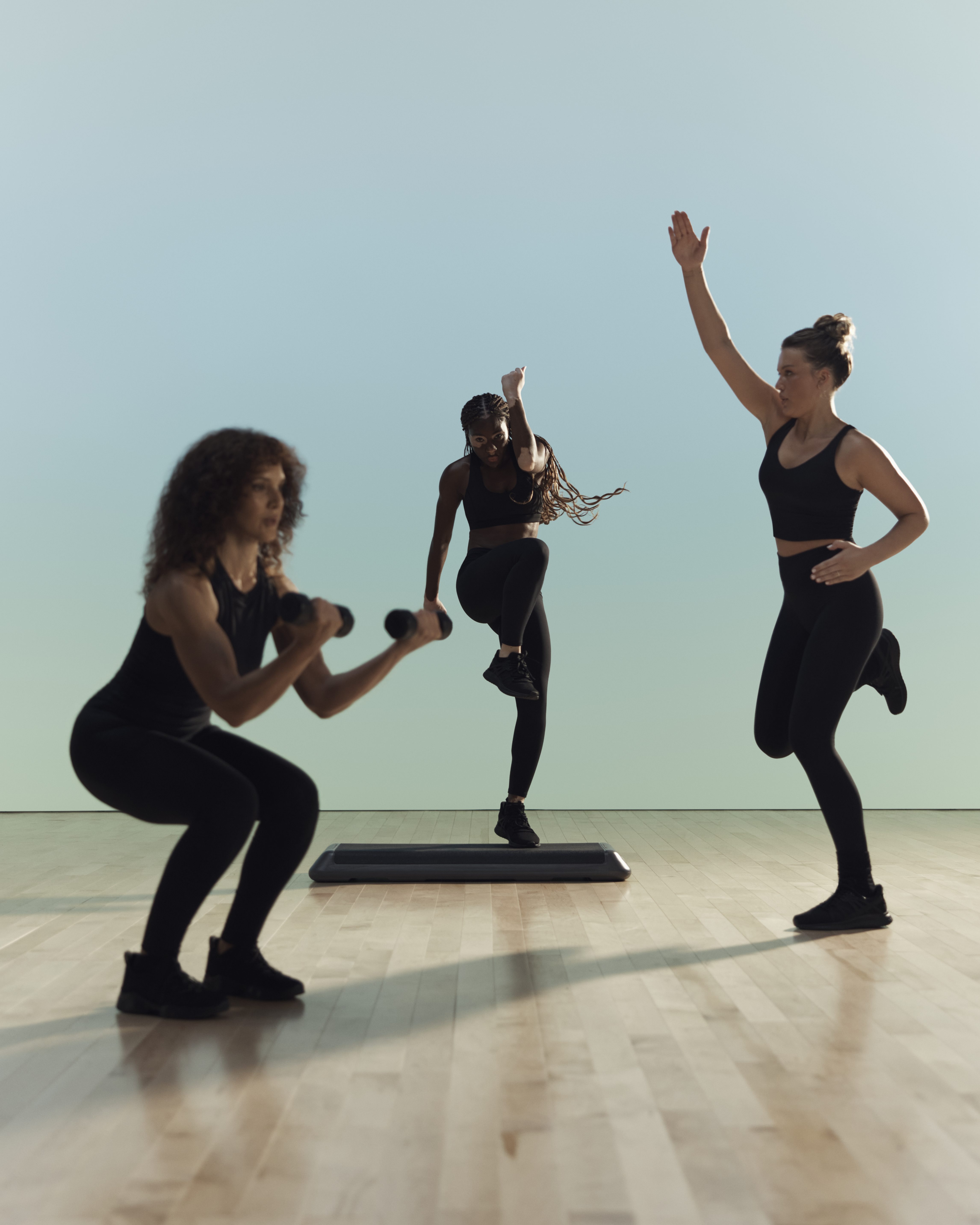 Remixx cardio class participants in various positions at Life Time