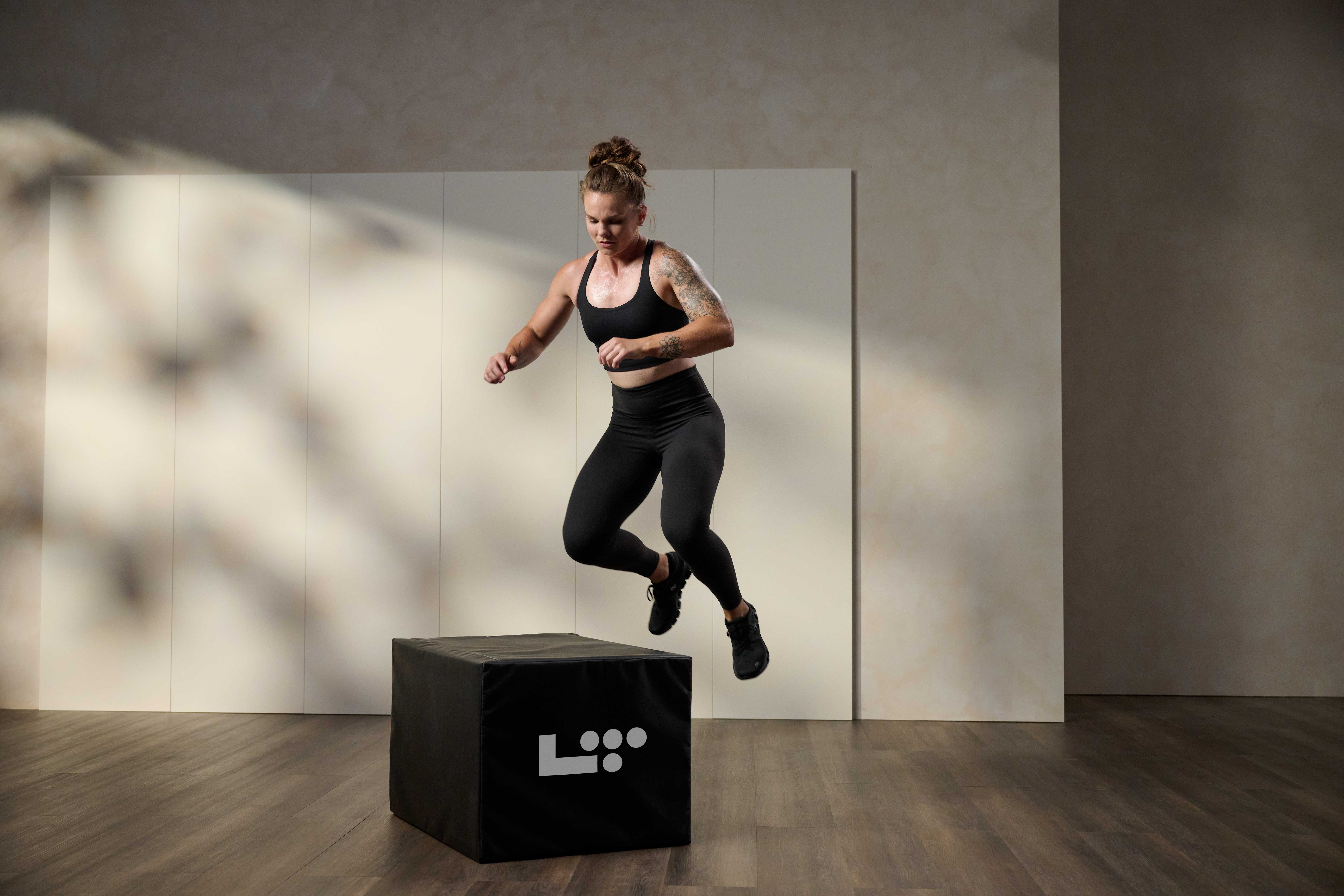 woman doing a box jumpover