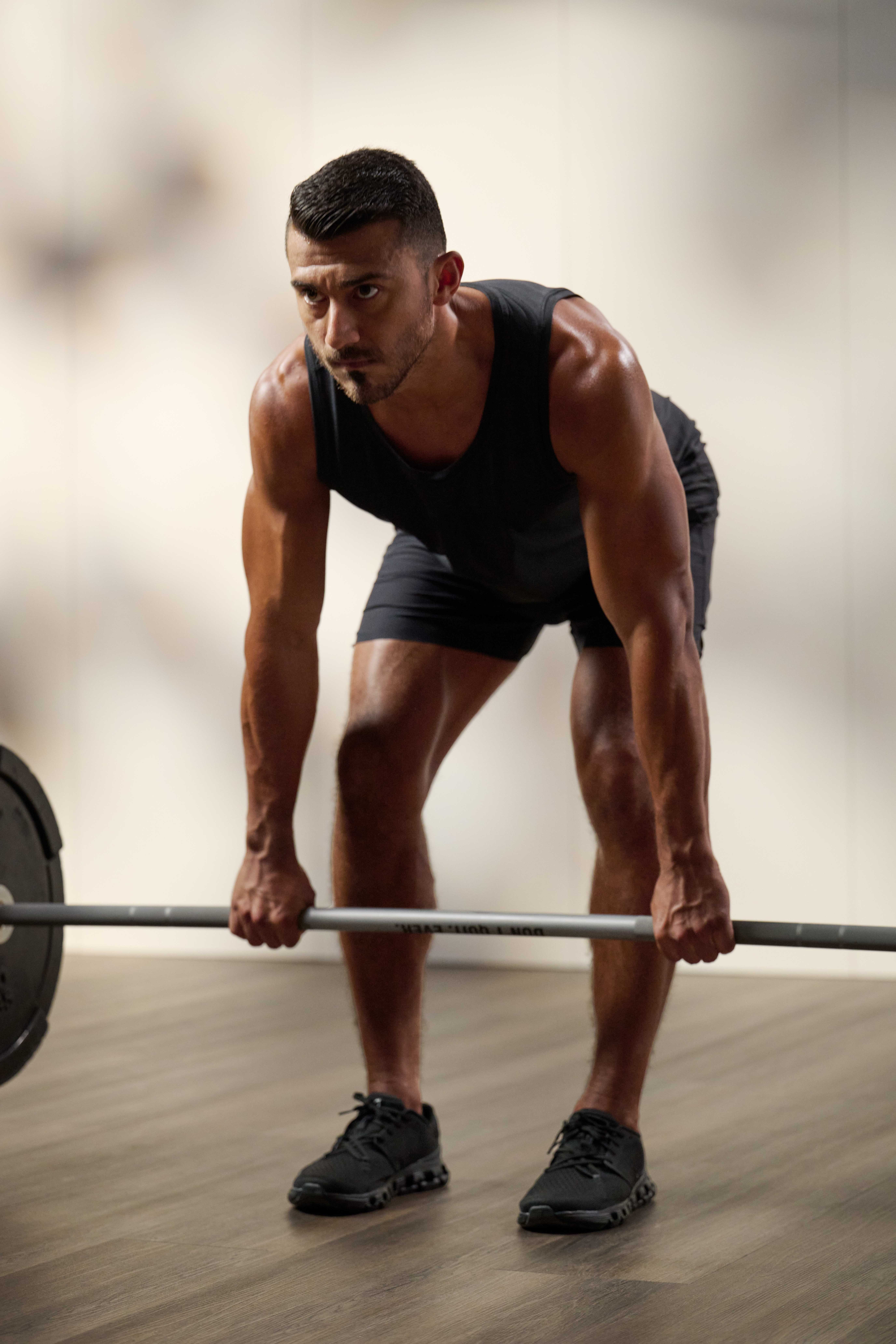 man bending over doing a deadlift
