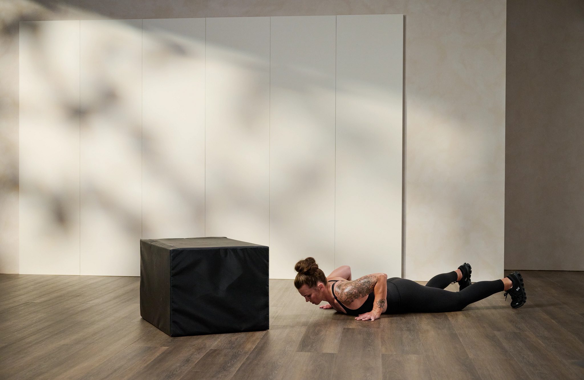 woman doing a pushup on the floor