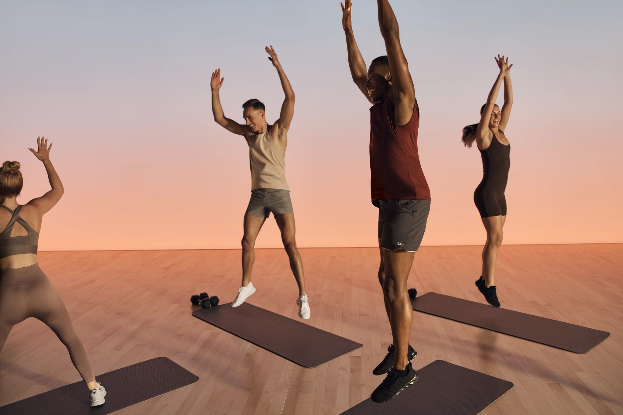 Shred strength members jumping during class
