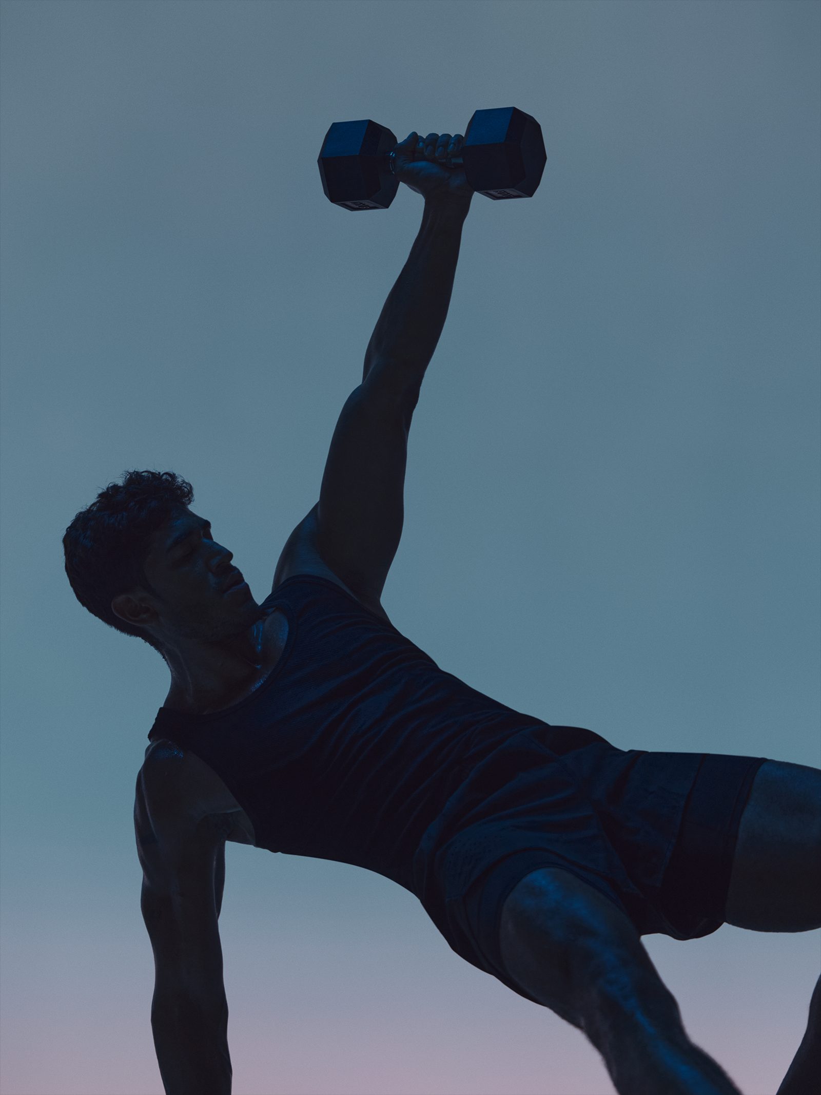 Maxout strength class featuring the silhouette of a man with a barbell above his head