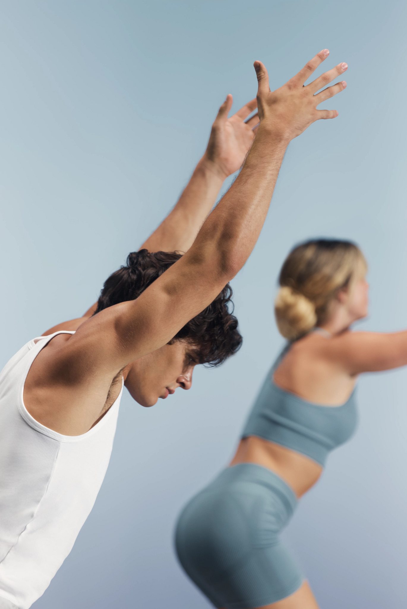 Sol yoga class students with arms extended