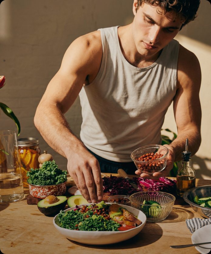 a man preparing a salad