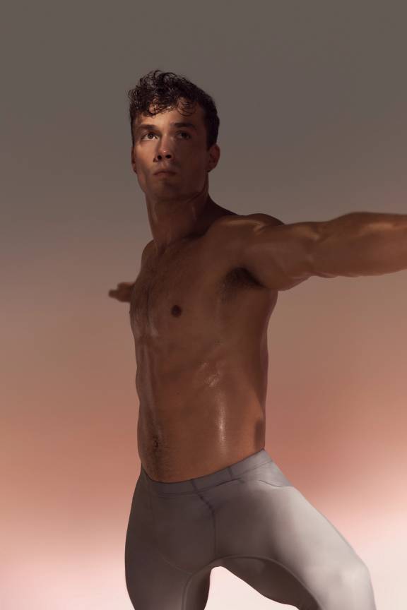 Yogi in warrior 2 position in warrior sculpt class at Life Time