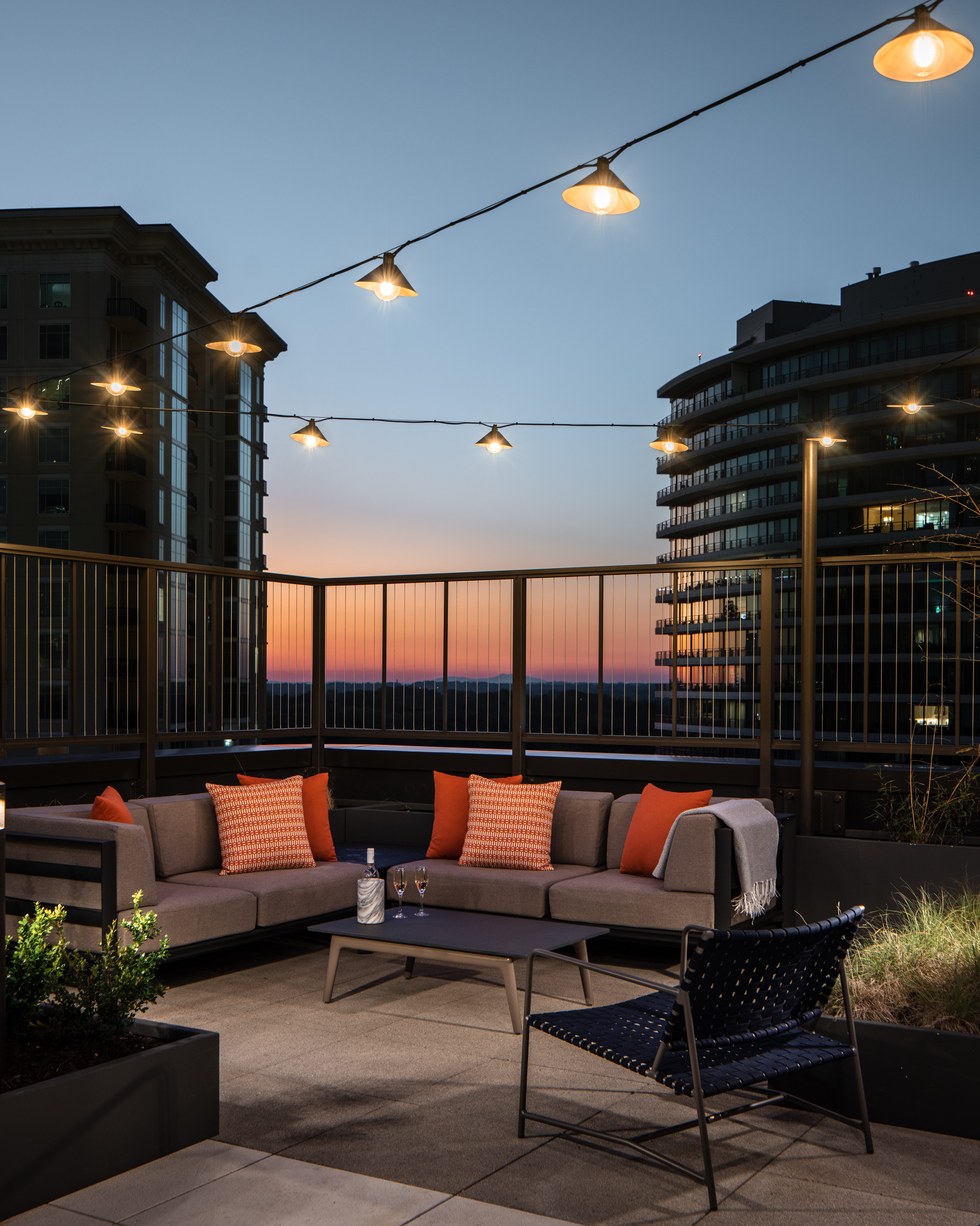 Rooftop outdoor seating area at dusk