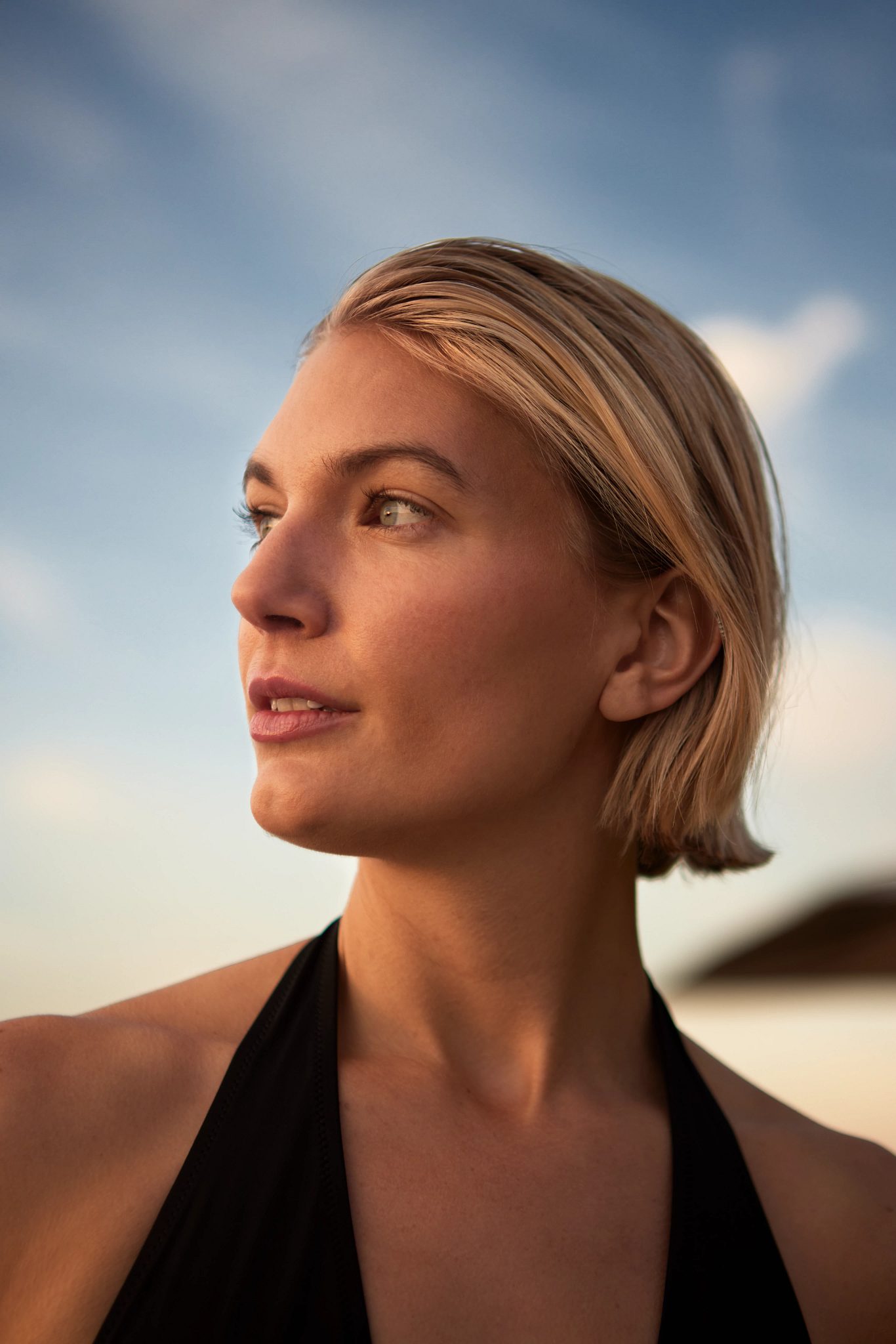 Closeup of a woman's face looking off into the distance