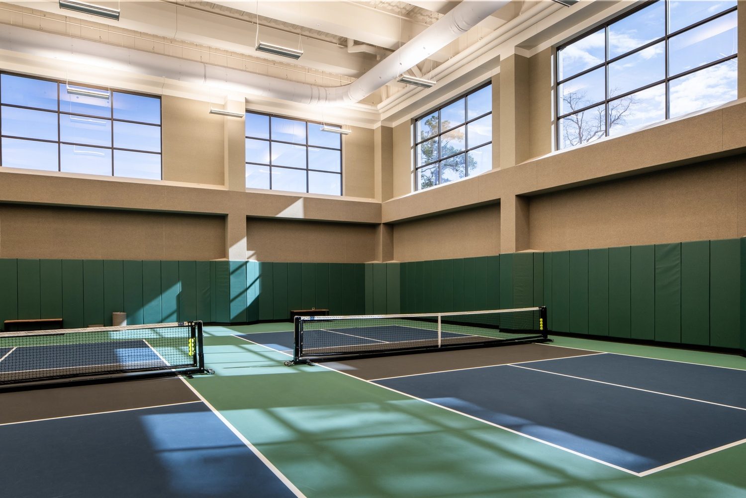 two indoor pickleball courts