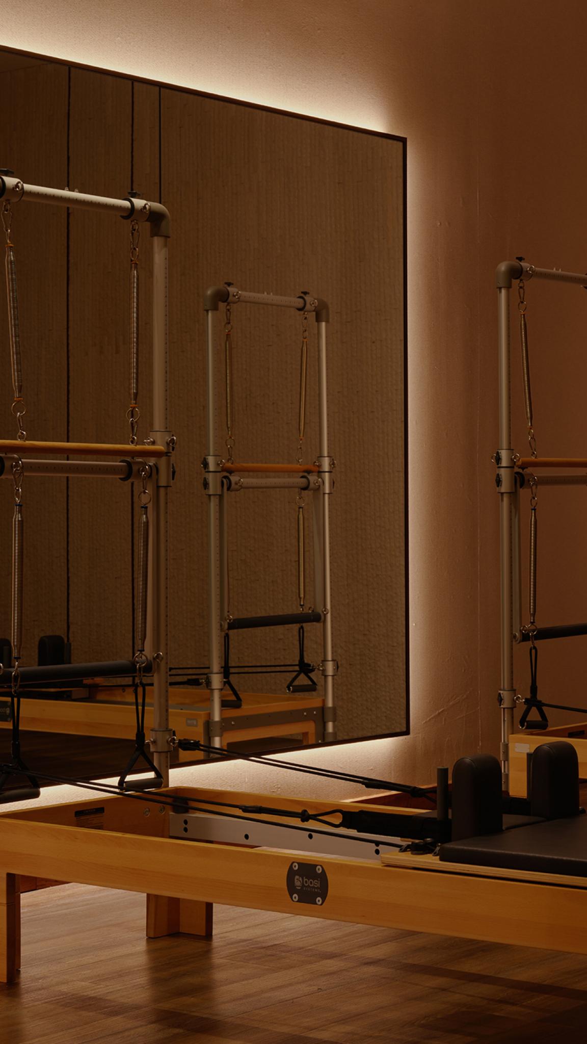 Pilates room with two reformer machines