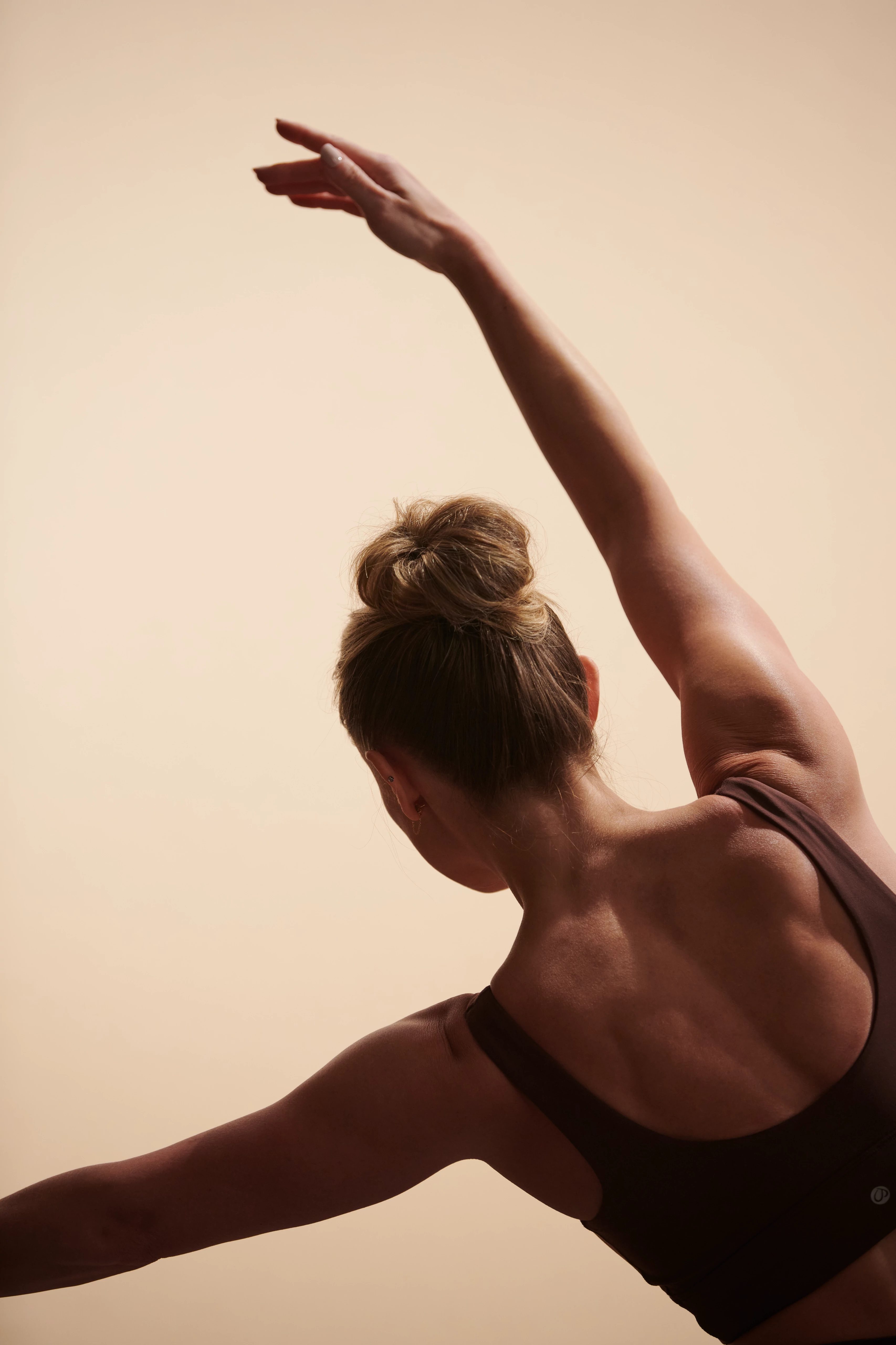 woman stretching her arm above her head