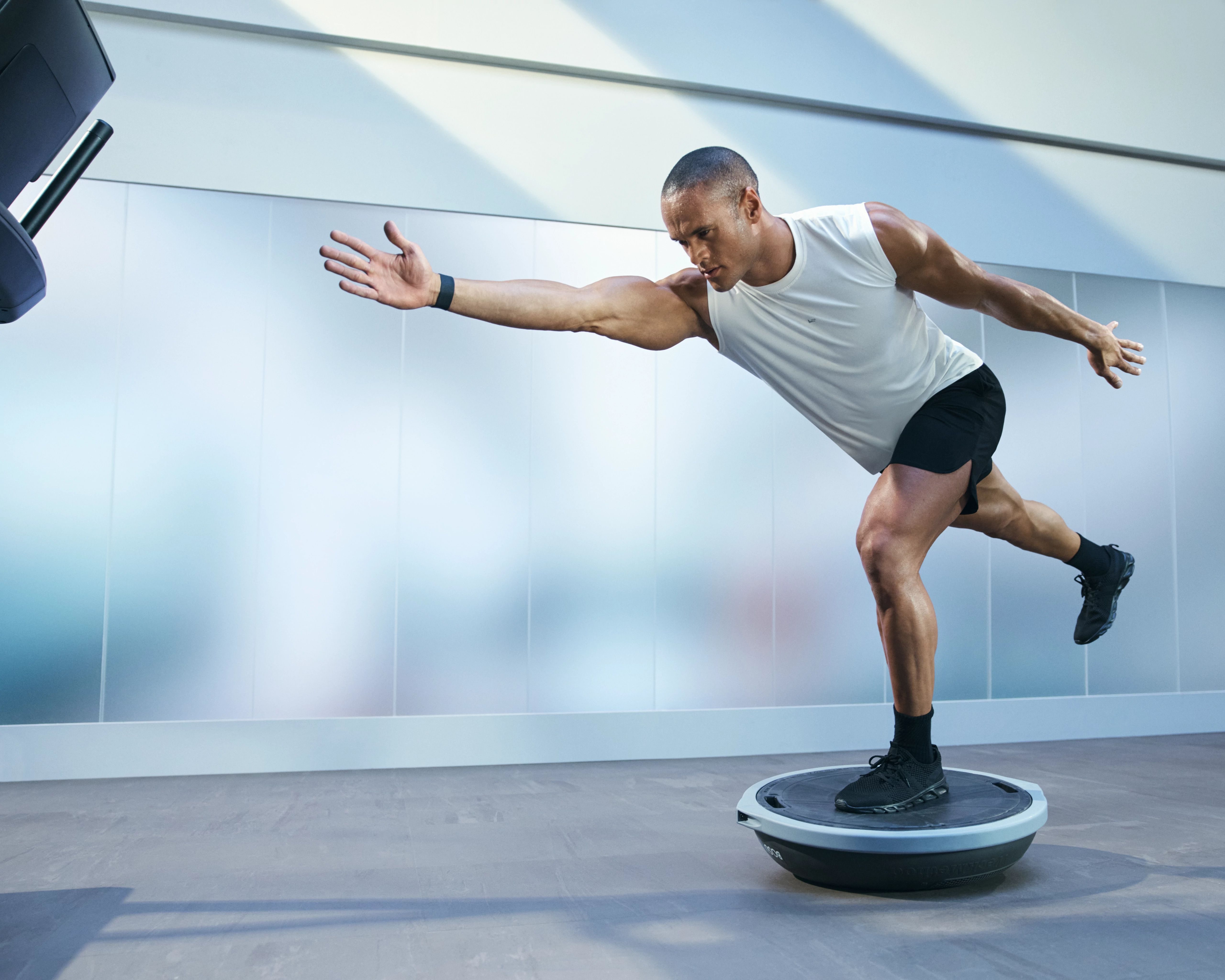 man balancing on a balance ball