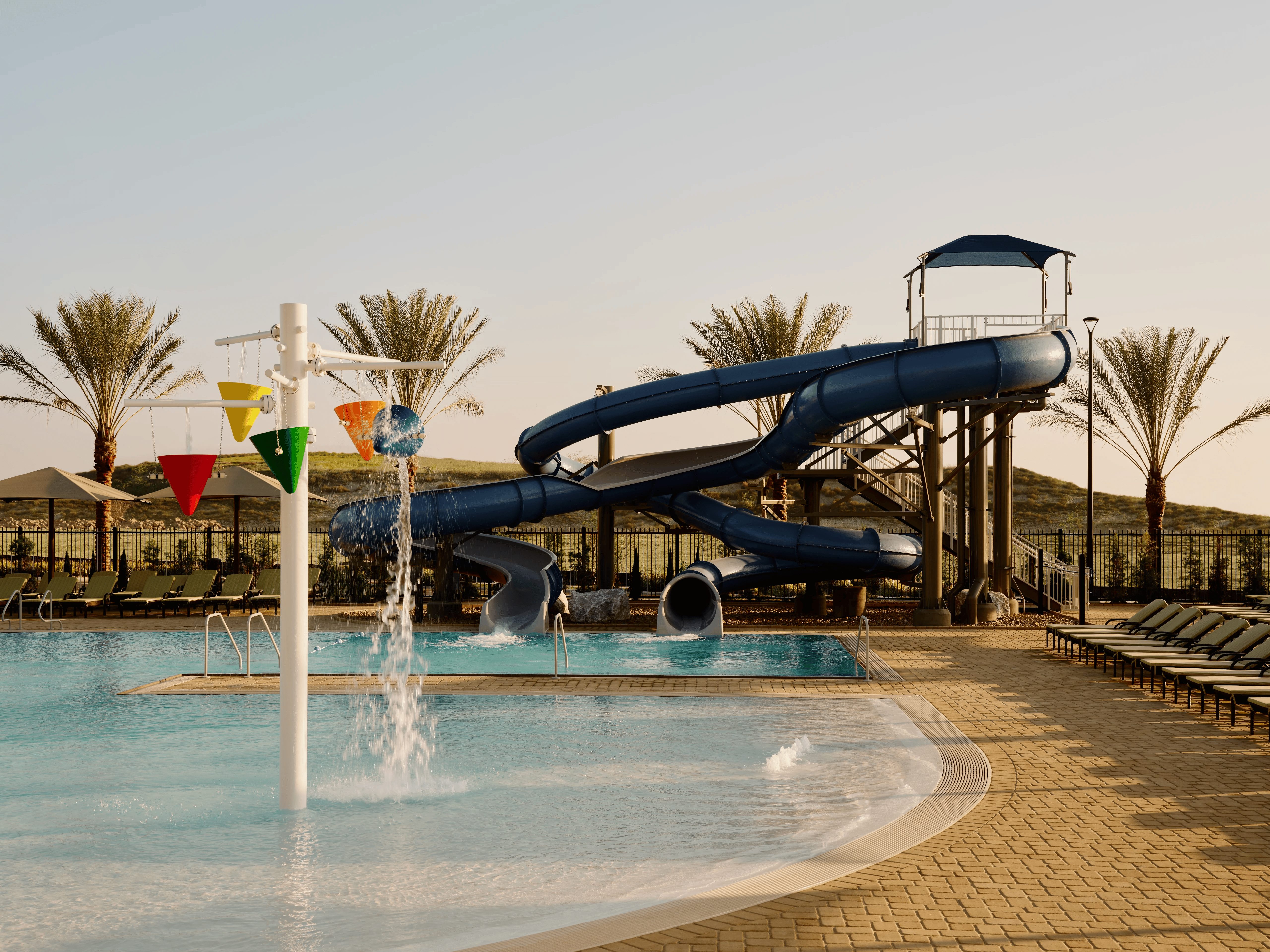 an outdoor waterslide and pool at Life Time