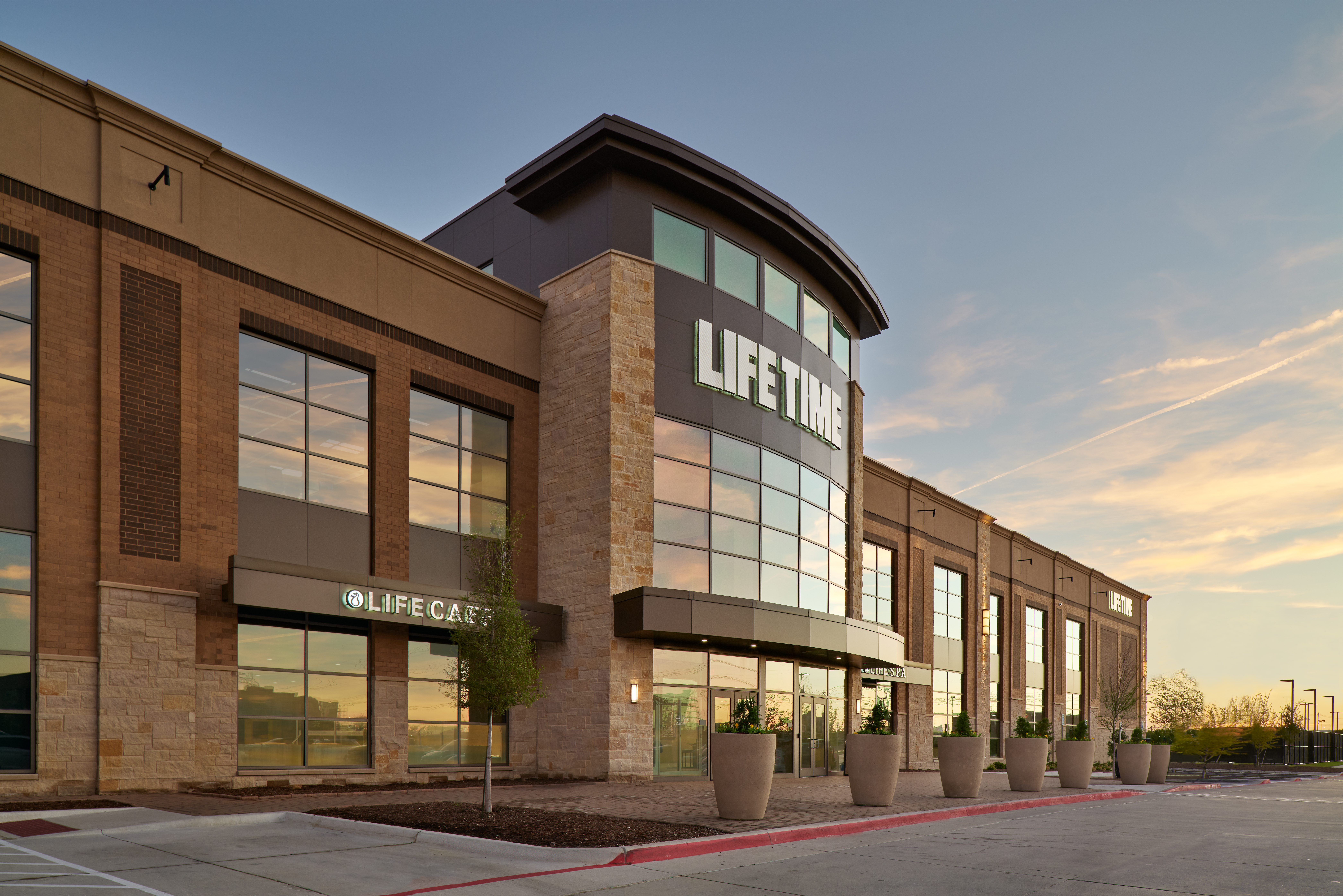 The exterior and front enterance of a Life Time location