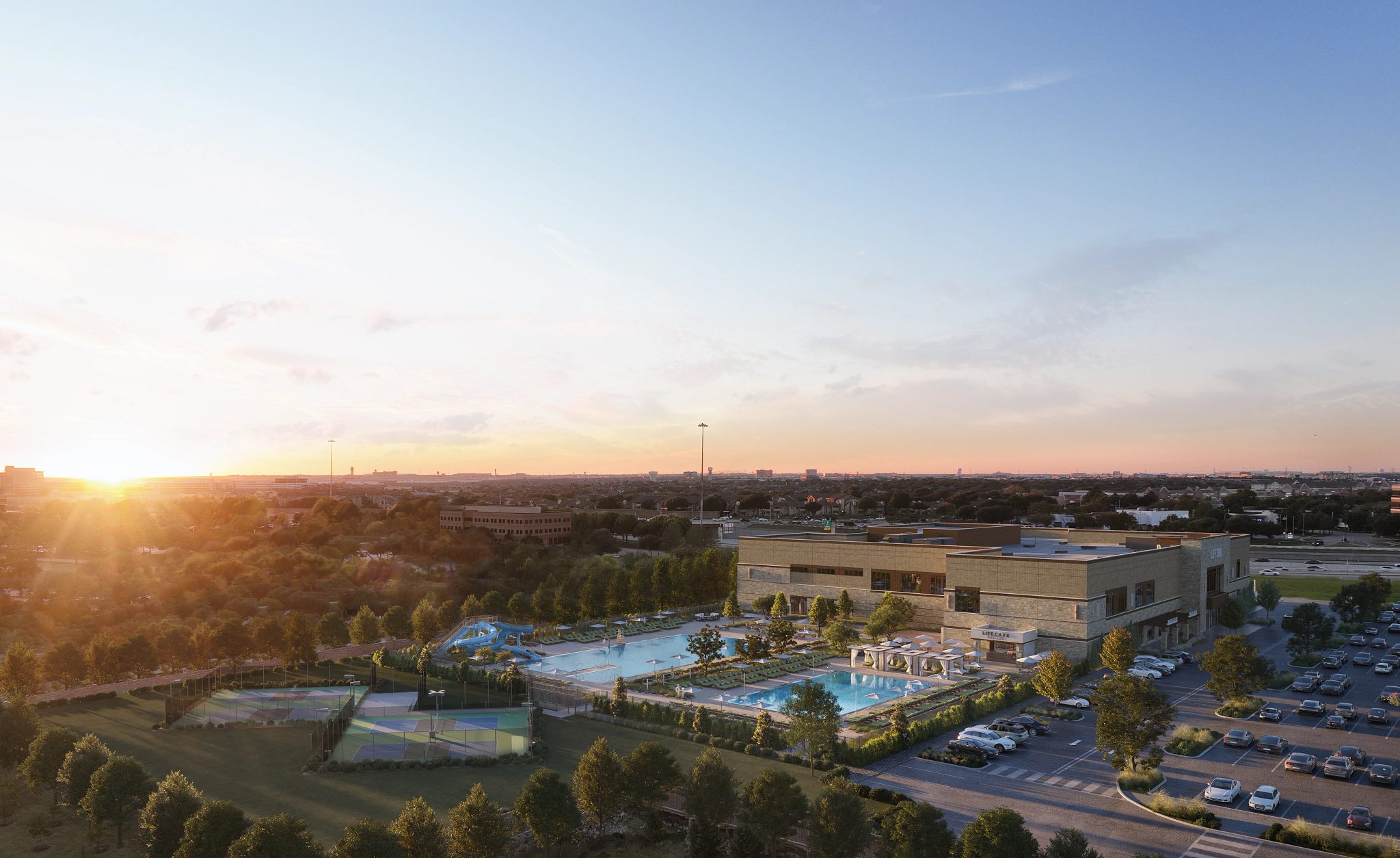 An aerial view of the exterior of Life Time Las Colinas at dusk