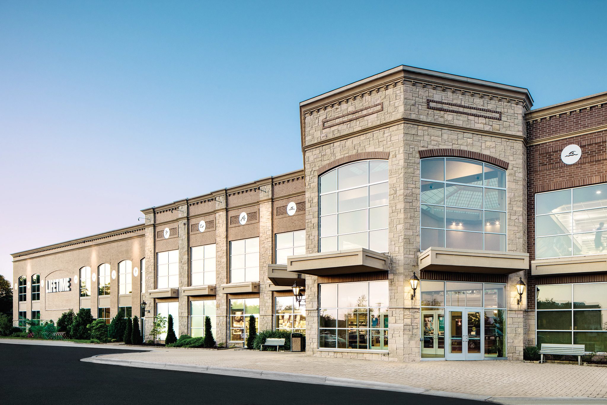 The exterior and front enterance of a Life Time location
