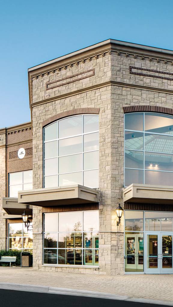 The exterior and front enterance of a Life Time location