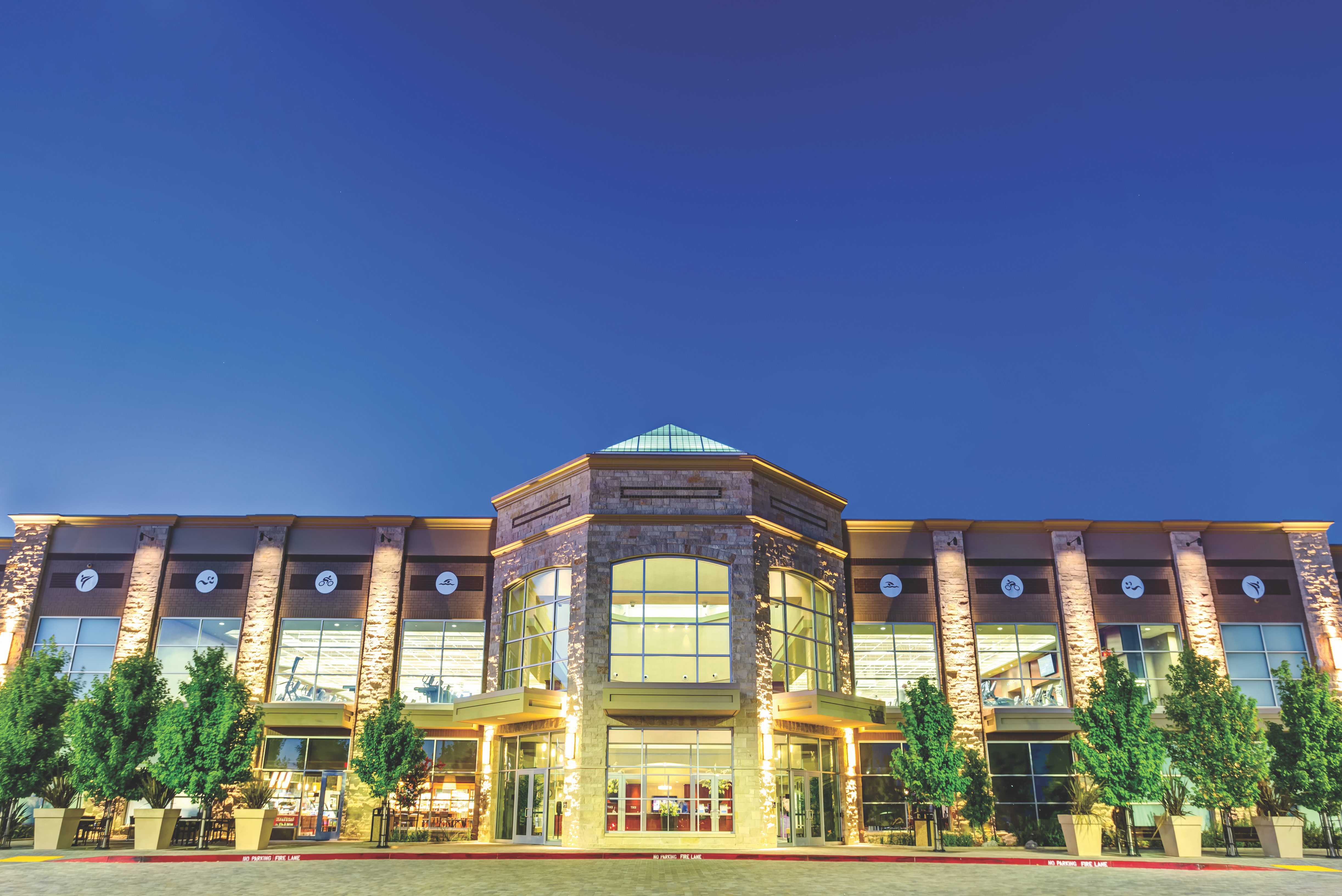 The exterior and front enterance of a Life Time location