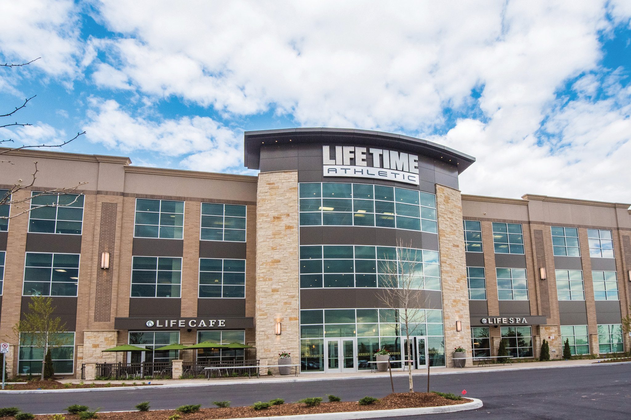 The exterior and front enterance of a Life Time location