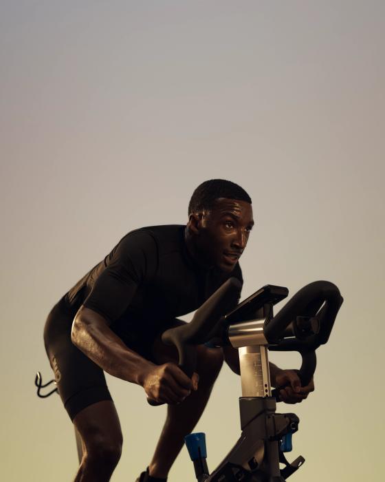 man riding a stationary bike