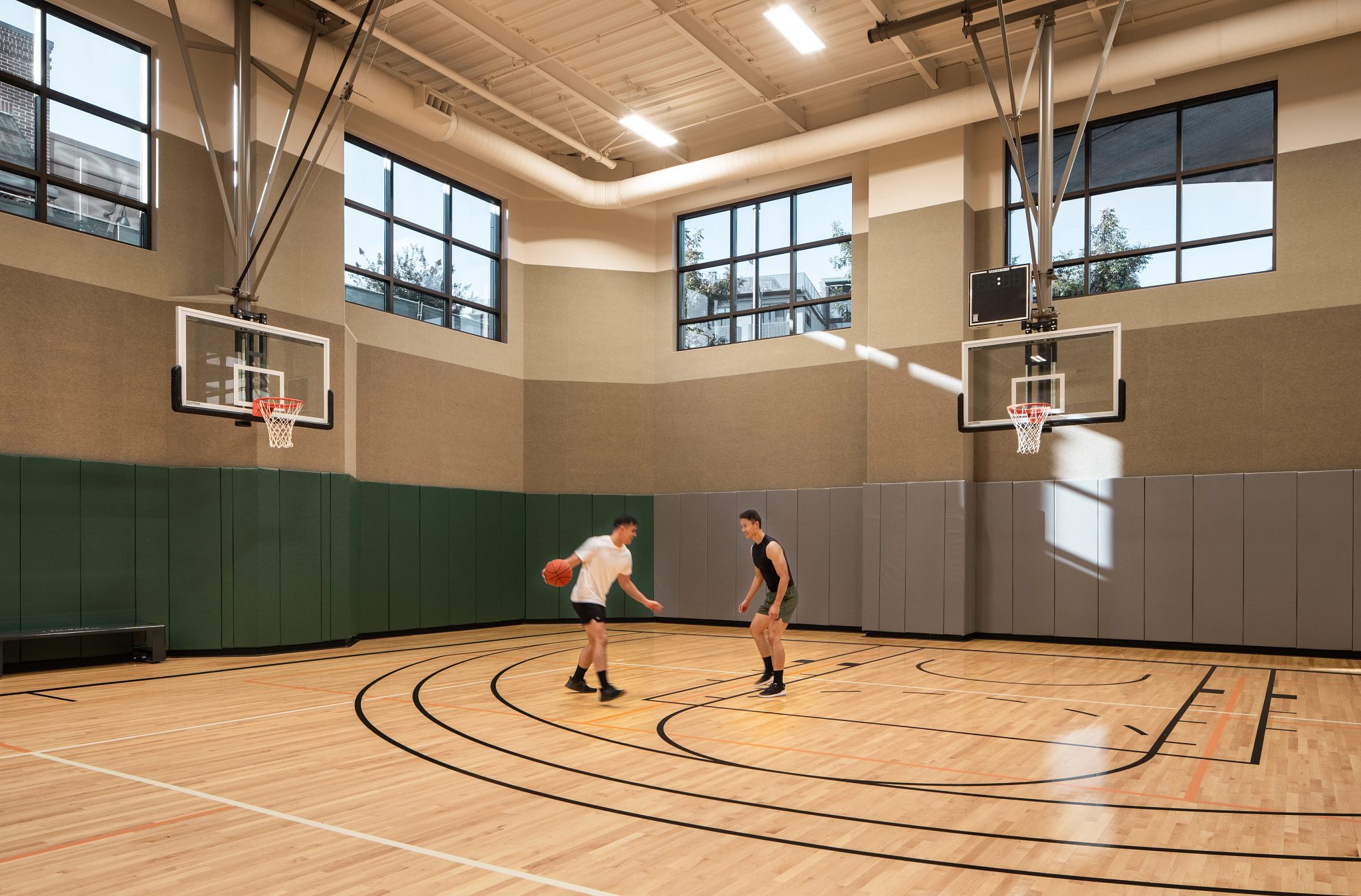 two men on a court playing basketball