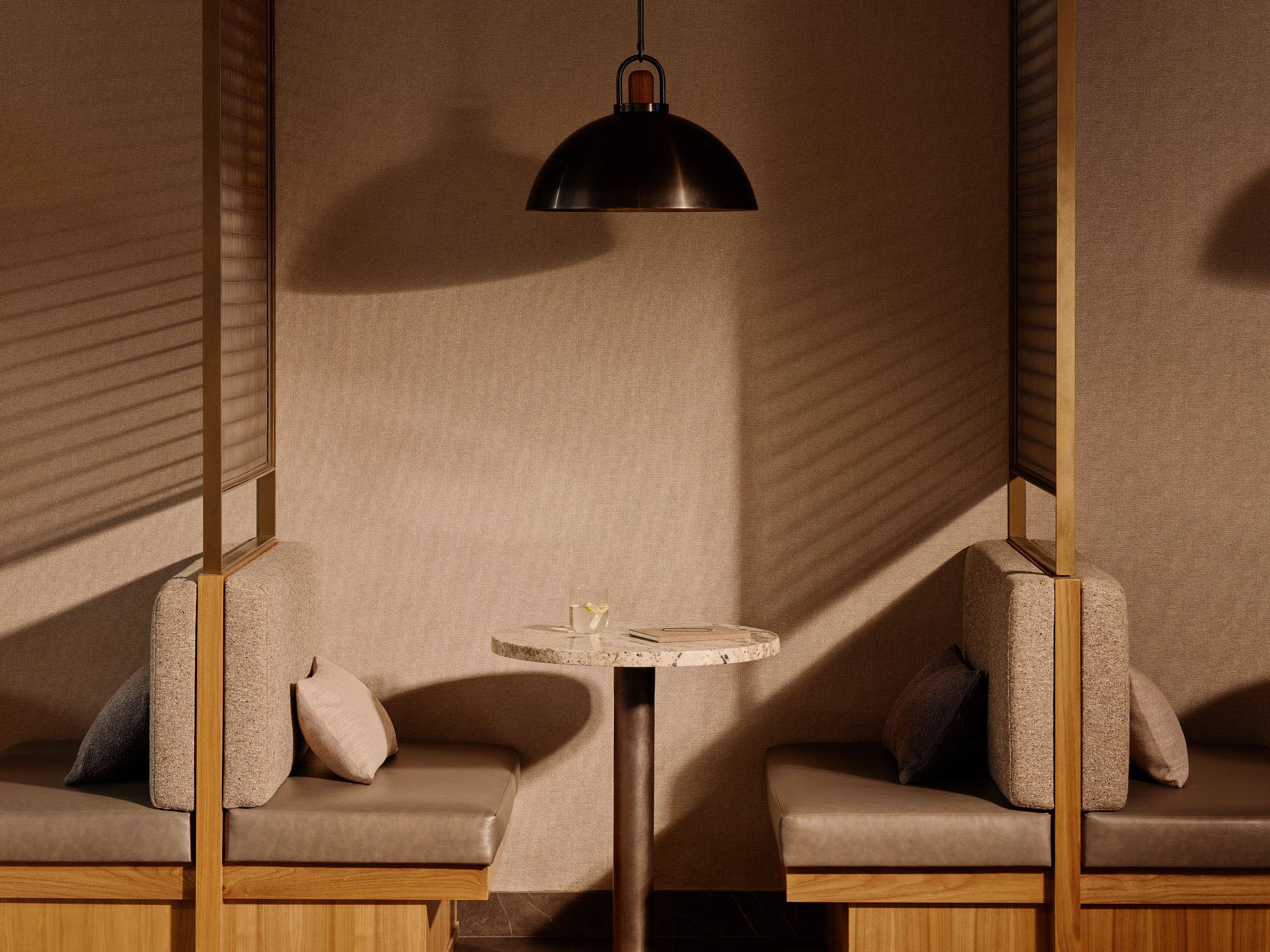 Open booth seating with expressive shadows and light