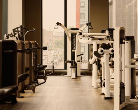 a line of wieght machines on a workout floor